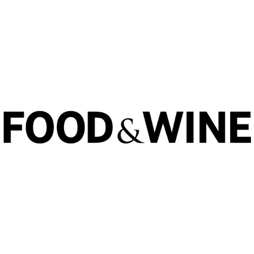 Logo with a wine glass, fork, and knife above the words 'FOOD & WINE' in black text.