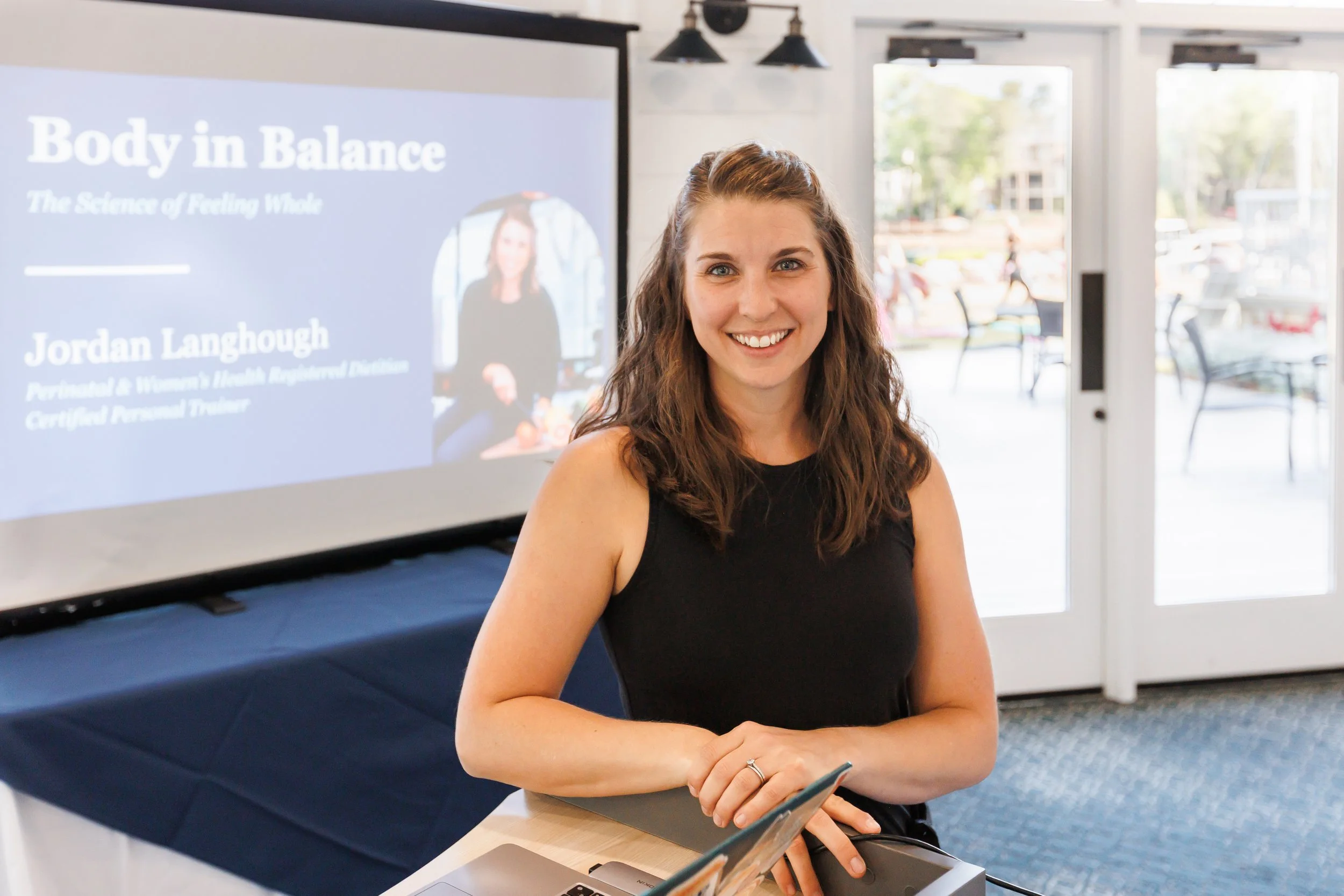 Jordan Langhough, fertility nutritionist presenting 'Body in Balance: The Science of Feeling Whole' at a speaking event