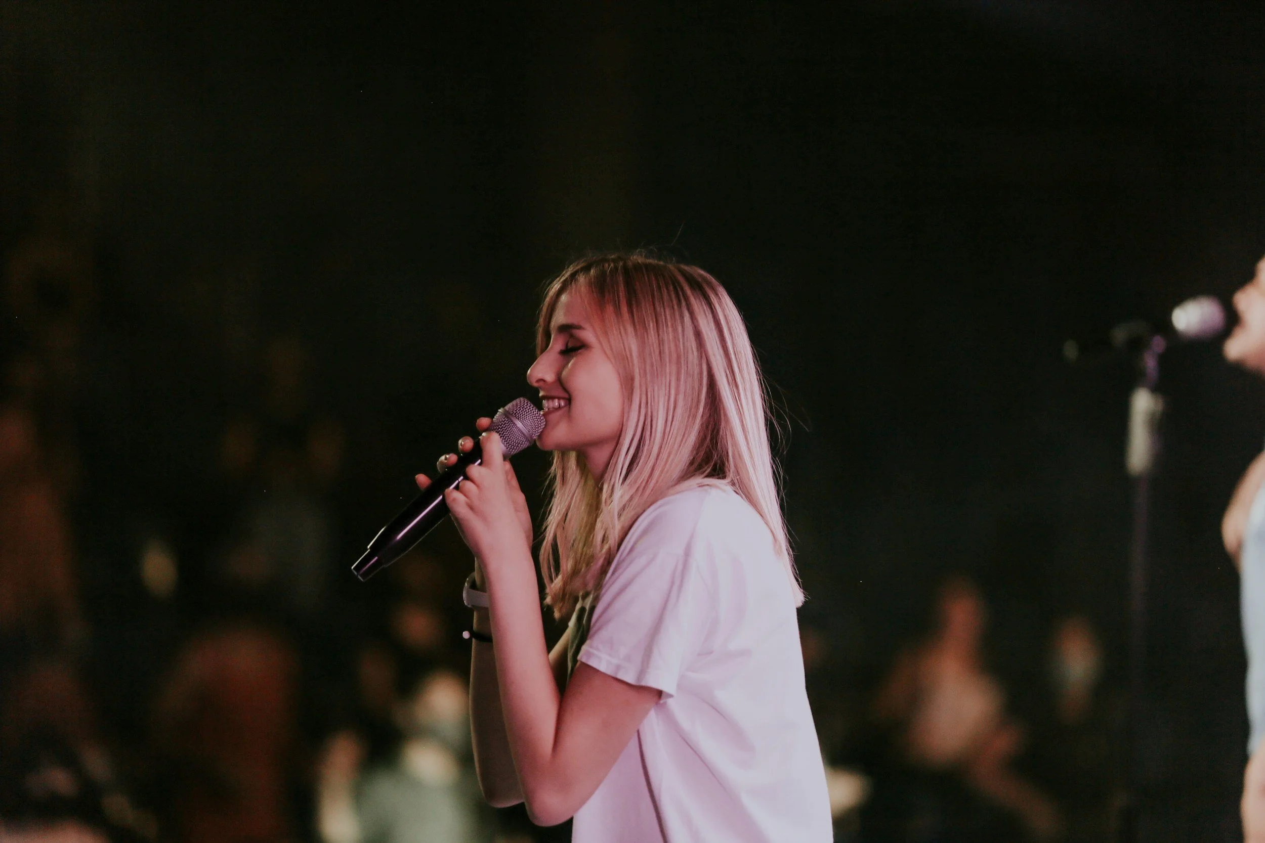 Side view of a singer performing