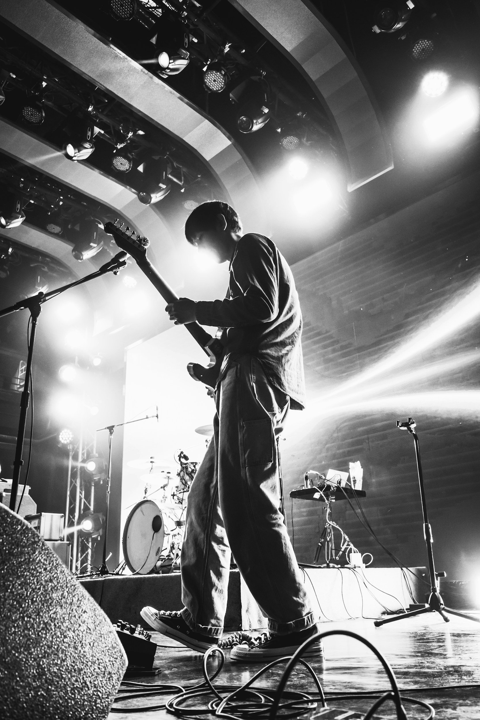 Black and white picture of a guitarist on stage