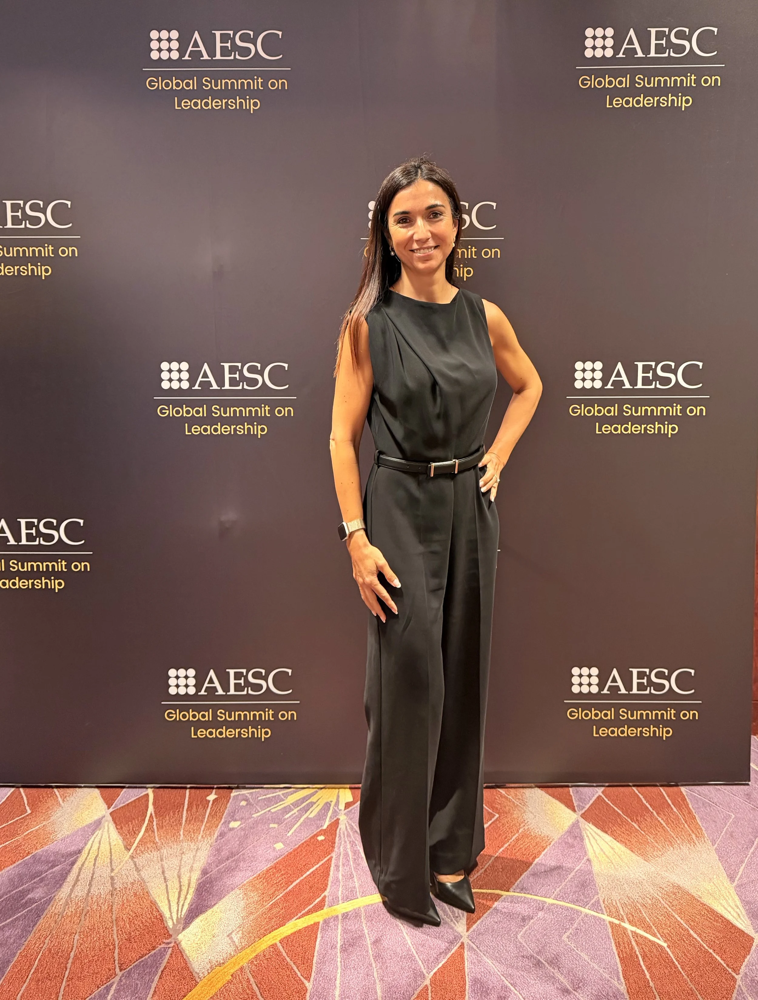 Woman in black in front of the AESC summit (Veronica LLorca-Smith)