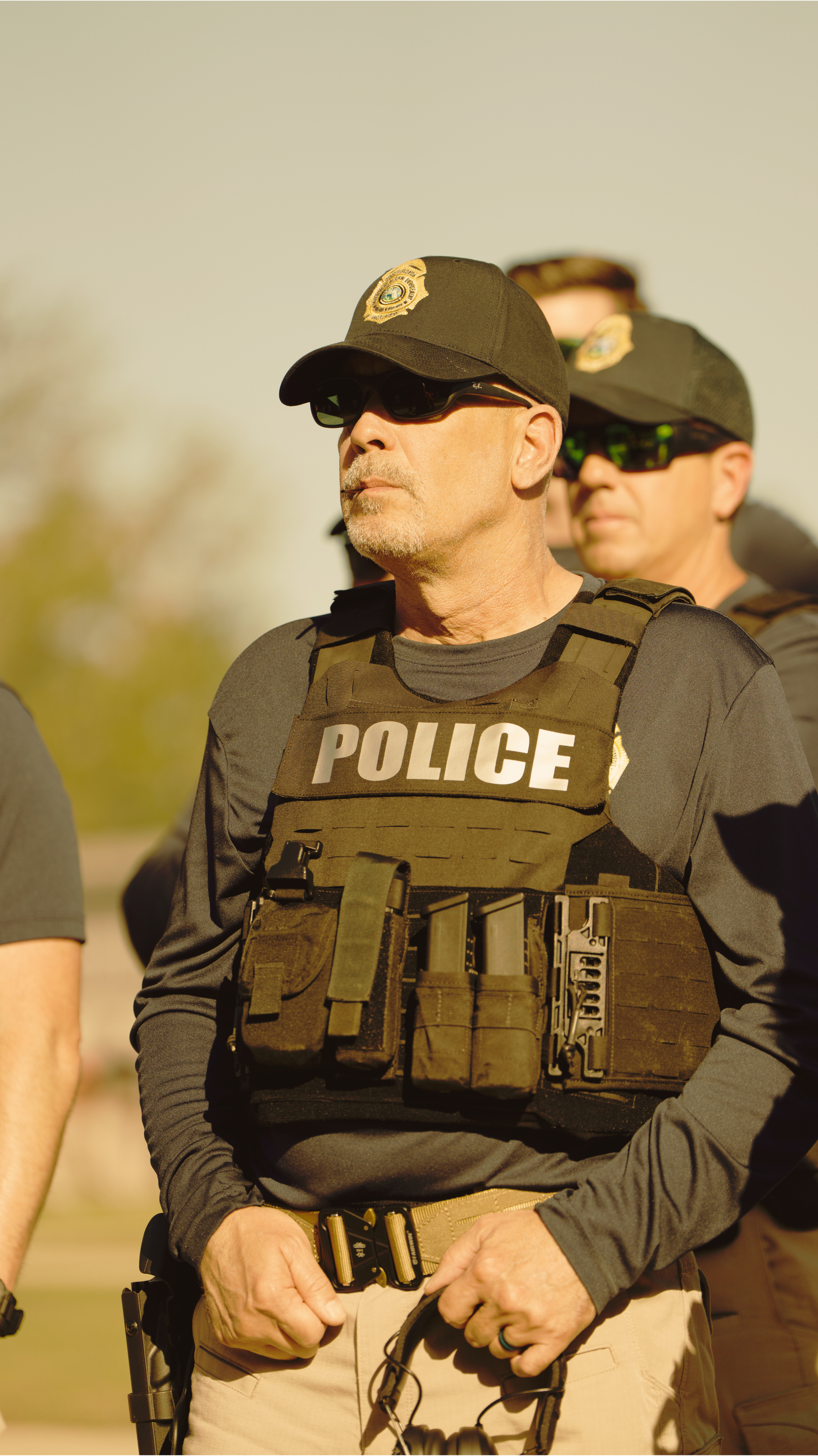 Rich Rodriguez with fellow officers in tactical vests on duty