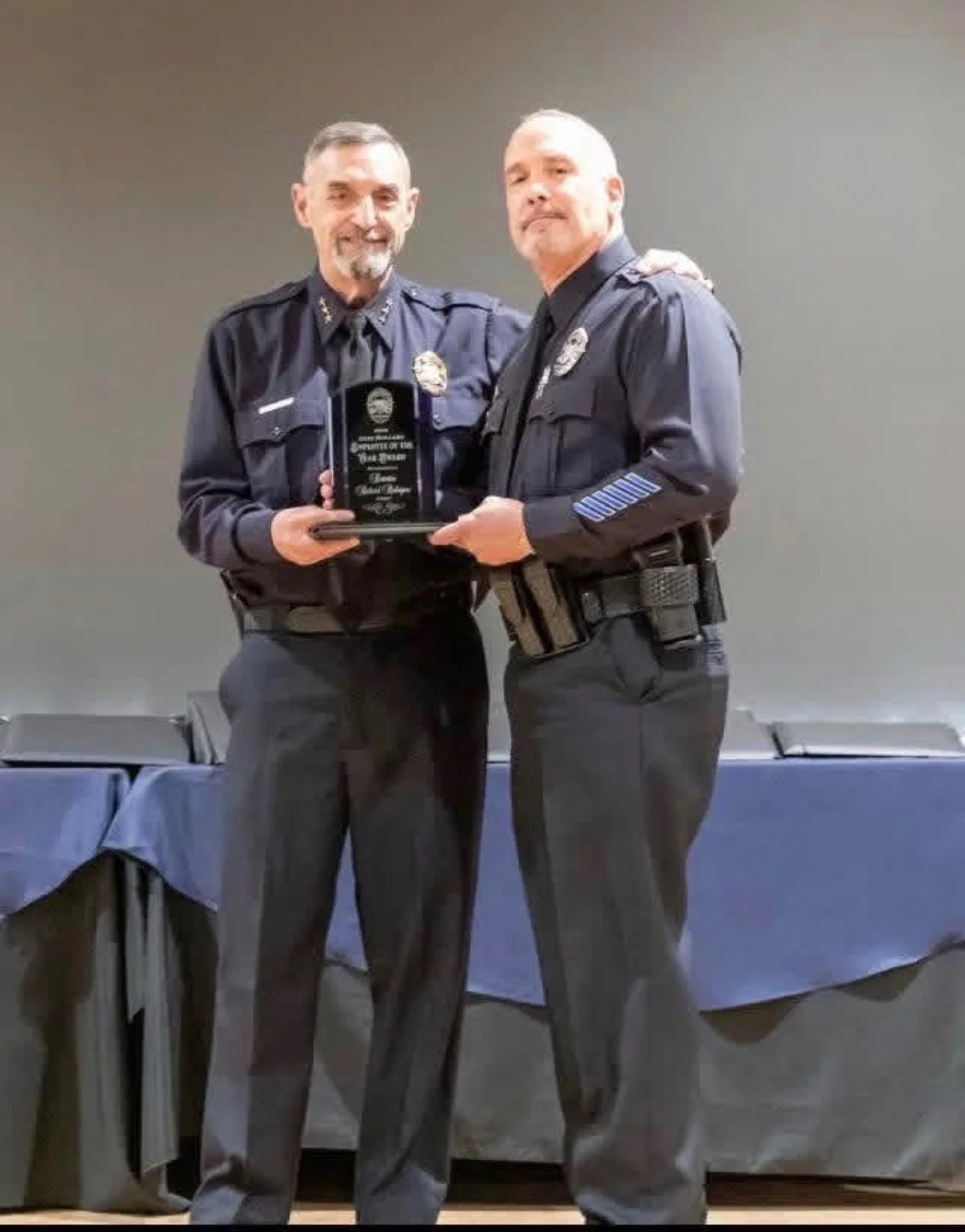 Rich Rodriguez recognized for service at a law enforcement ceremony