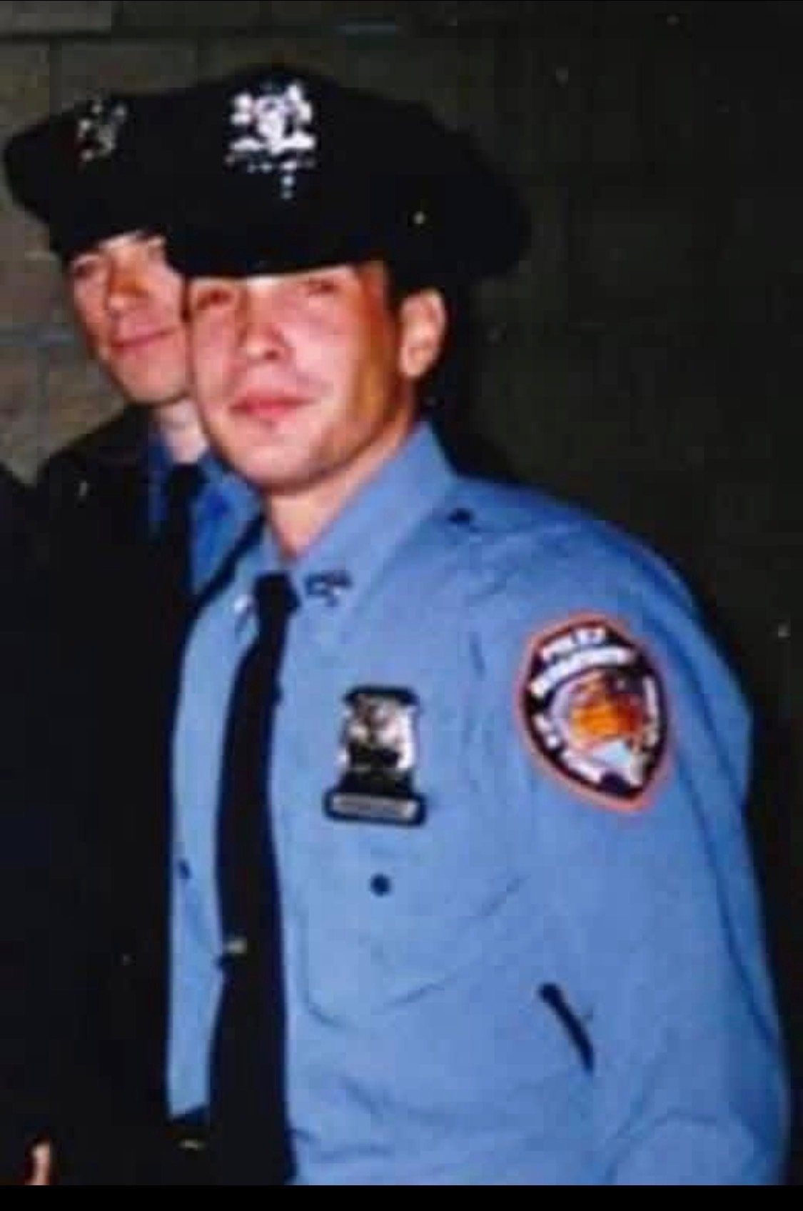 Rich Rodriguez as a young NYPD officer in uniform