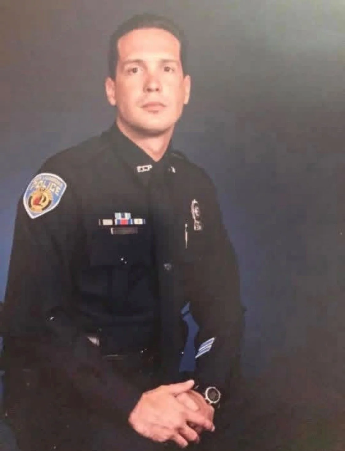 Rich Rodriguez in his police uniform during his law enforcement career