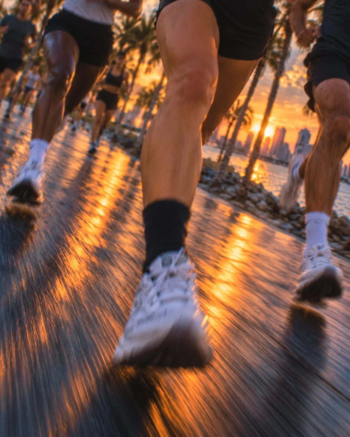 Runners at sunset