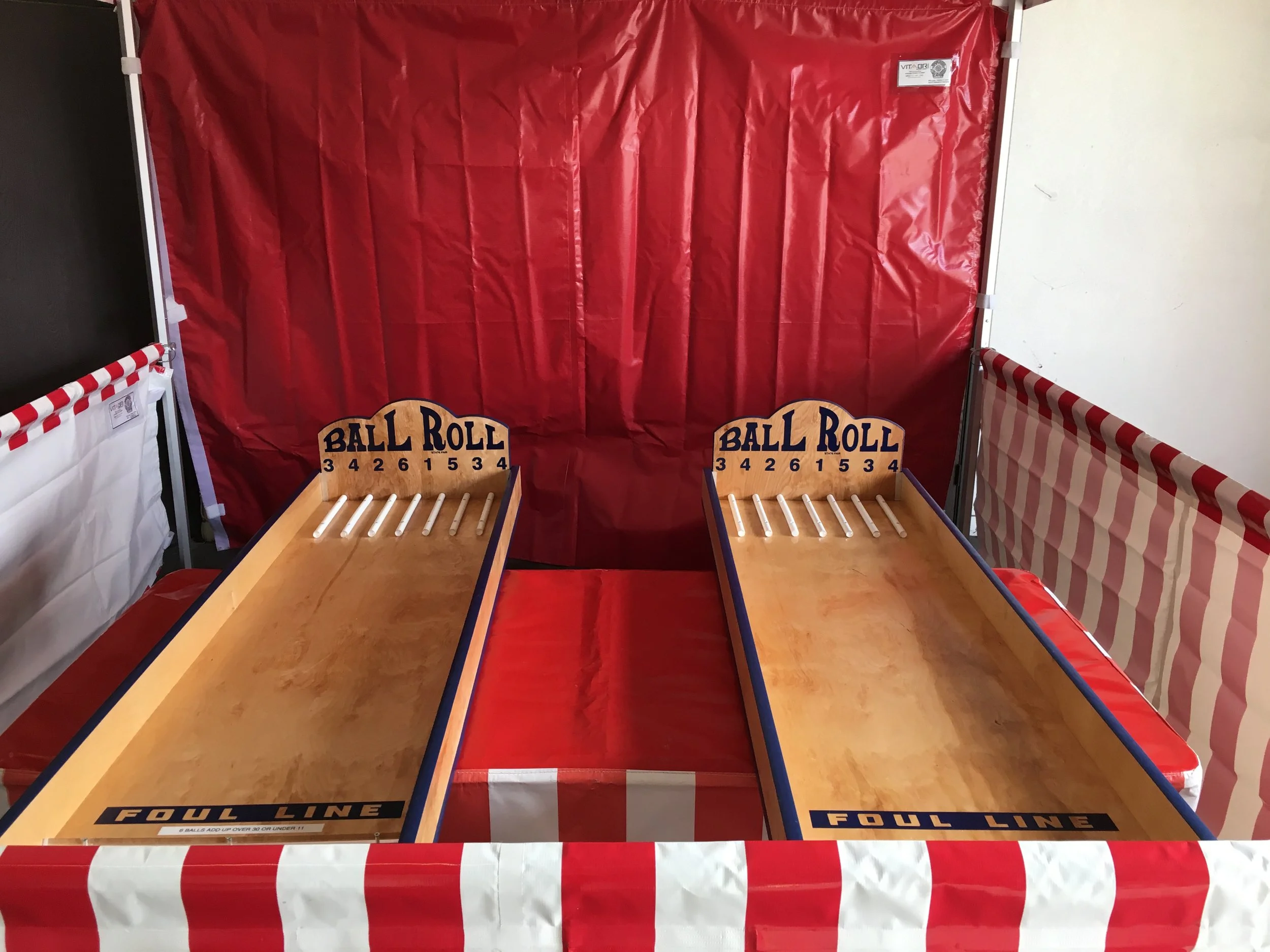 A carnival game booth featuring a fun game.