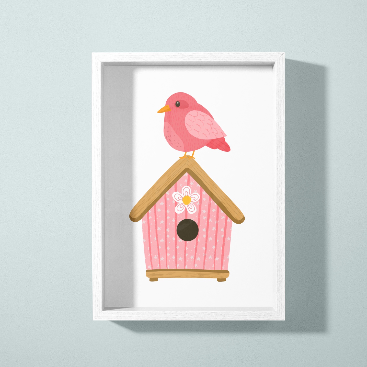 Pink birdhouse with a pink bird perched on top, set against a light-colored wall.