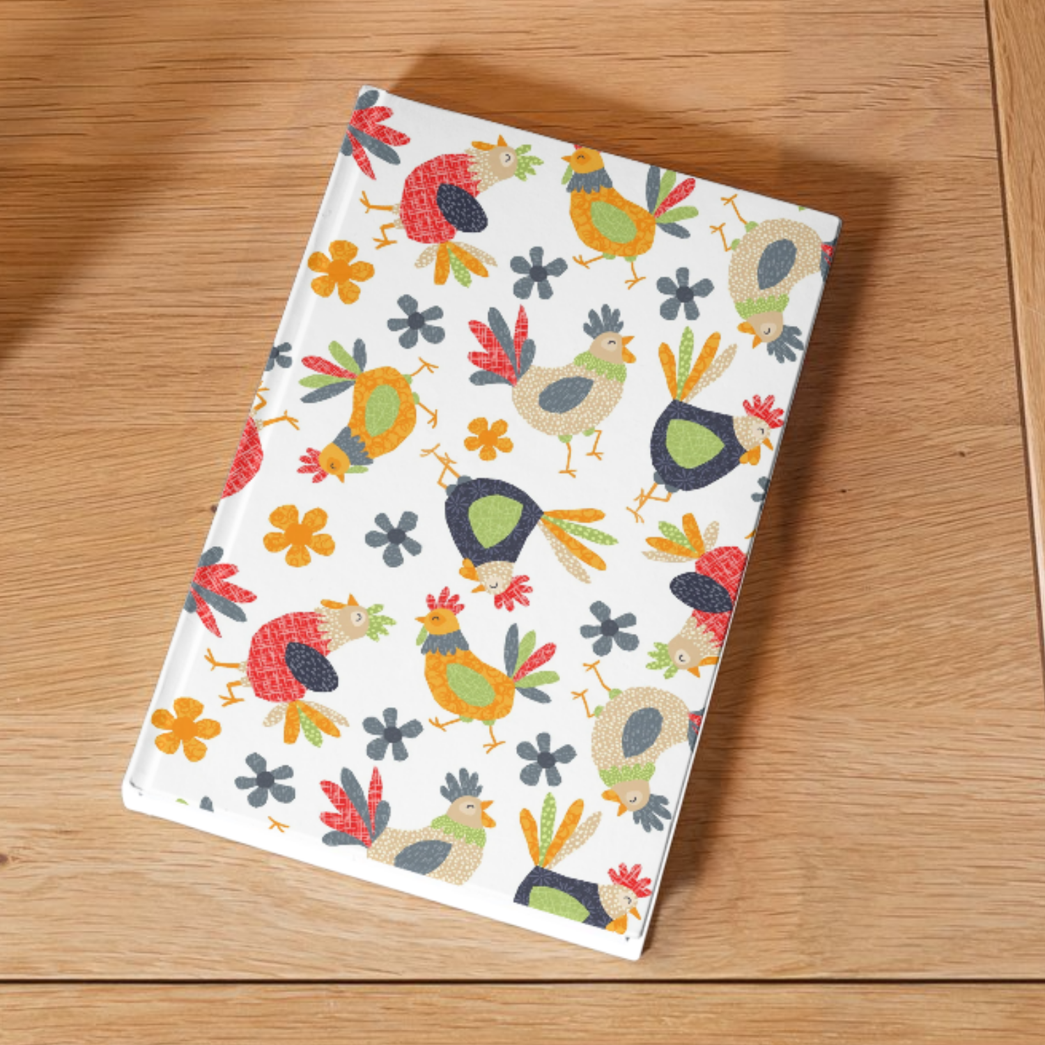 A rectangular white tray with a colorful pattern of cartoon-style chickens and flowers, placed on a wooden surface.