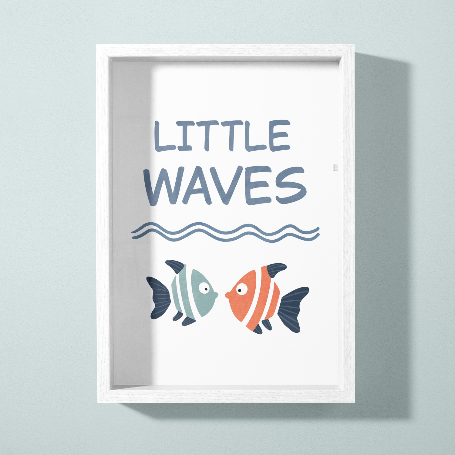A white framed poster with the text 'LITTLE WAVES' at the top, a wavy line underneath, and two colorful fish facing each other at the bottom.