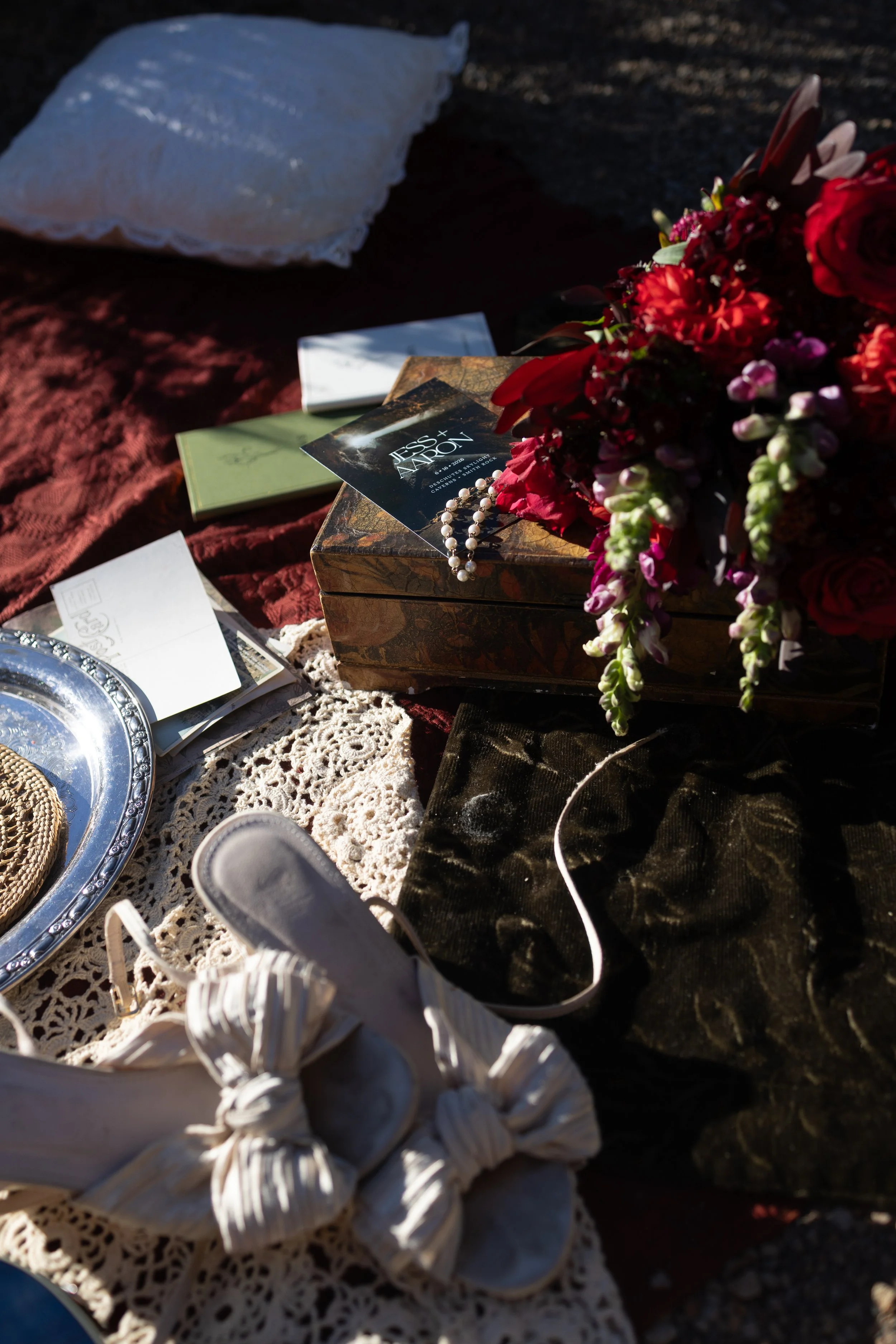 A travel inspired flat lay of invitation to an intimate elopement in the pnw, Smith Rock