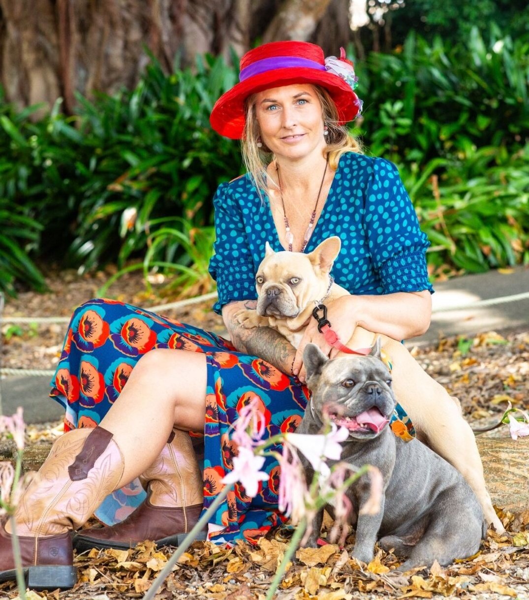 Olivia from Le Epitome Kennels in Waikato, New Zealand, pictured at Auckland Botanic Gardens with Pluto, a blue brindle coloured French Bulldog, and Eden, a new shade Isabella coloured French Bulldog with striking light-coloured eyes.