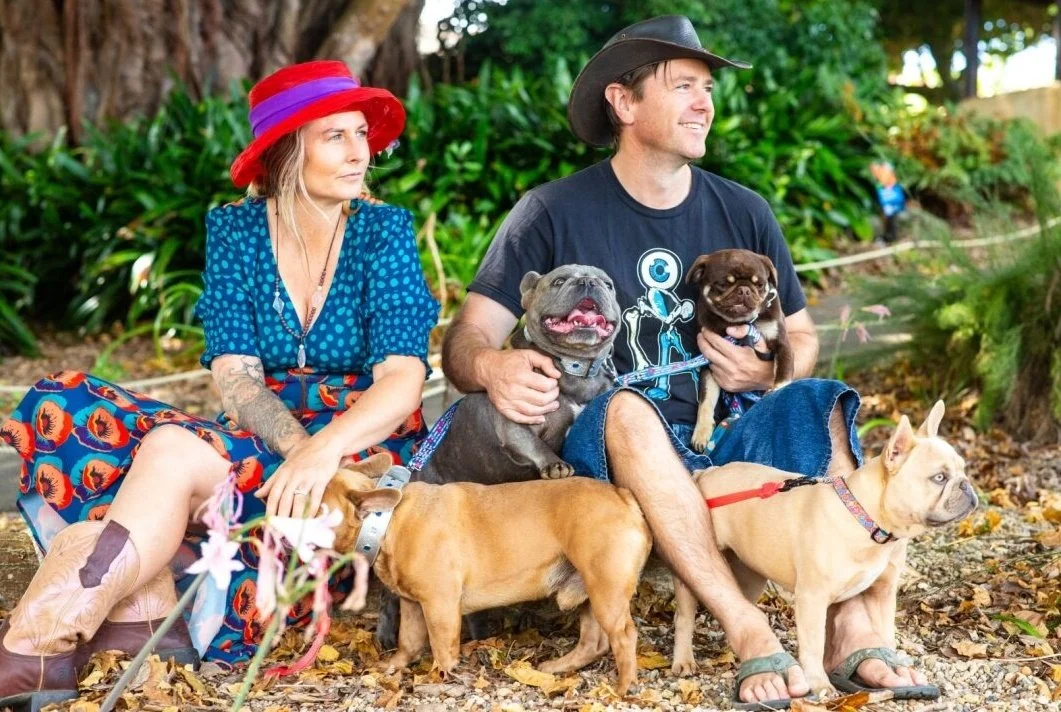 Olivia and Alistair Potter of Le Epitome Kennels with their French Bulldogs and Pugs in Auckland Botanical Gardens, New Zealand.