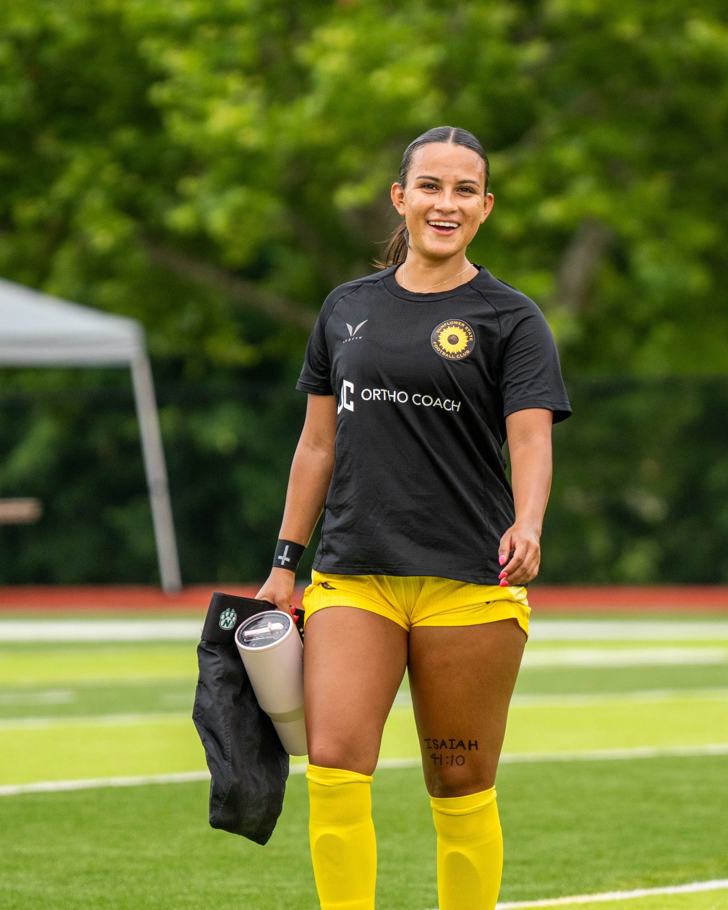 Sunflower State FC's Ximena Arnau smiles while walking to the locker room from warmups at home vs Oklahoma City FC on June 6th, 2026 - Photo by: Austin Farrow