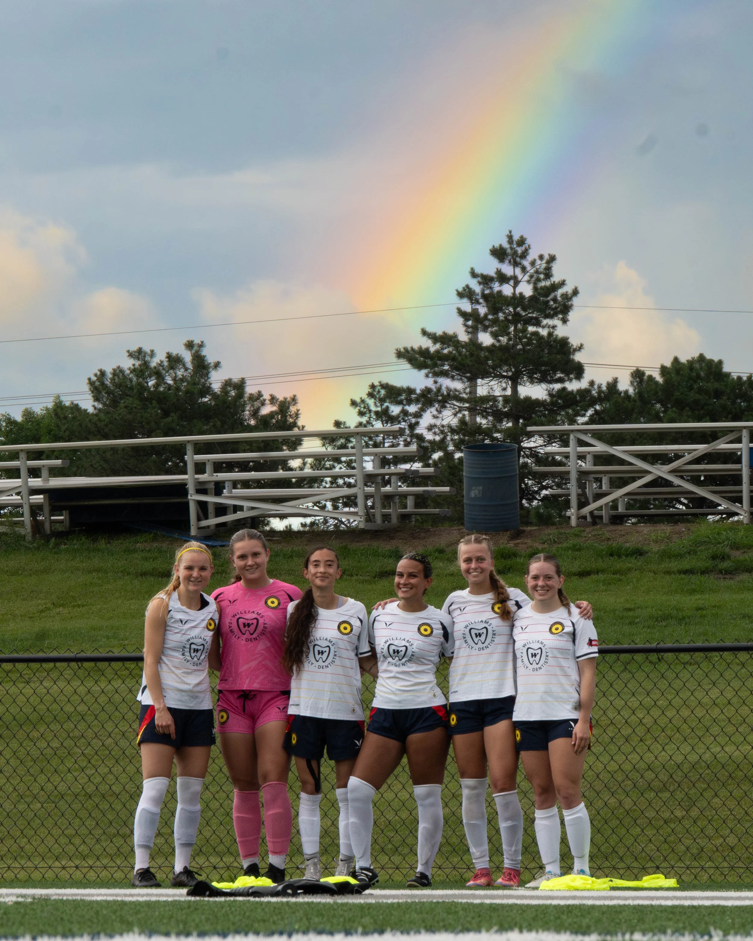 Sunflower State FC players posing in front of a rainbow at halftime on June 7th, 2026 - Photo by Austin Farrow