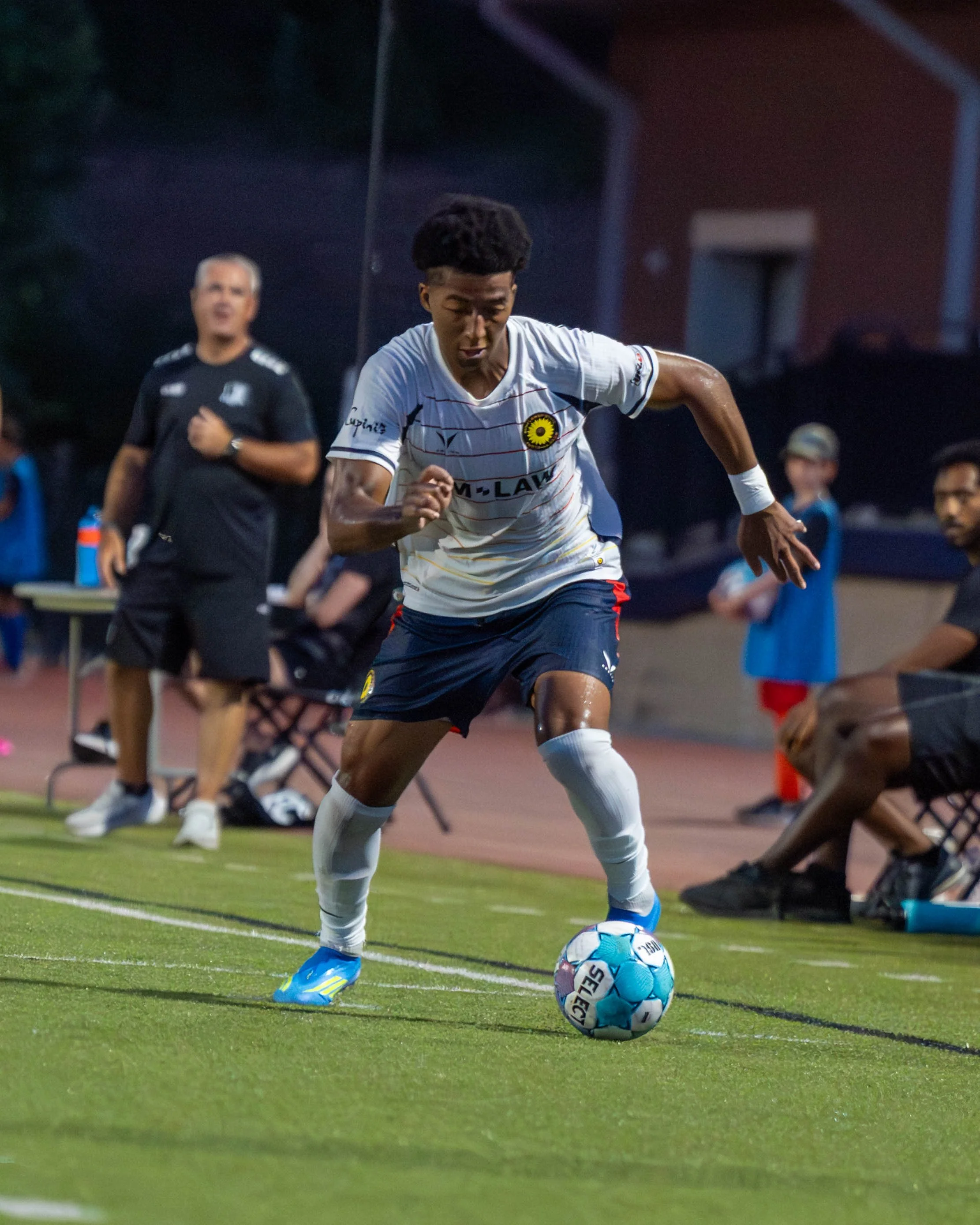 Sunflower State FC's Immanuel Wayoro (#7) dribbling with the ball on the road against FC Ambush on June 13th, 2026 - Photo by: Austin Farrow