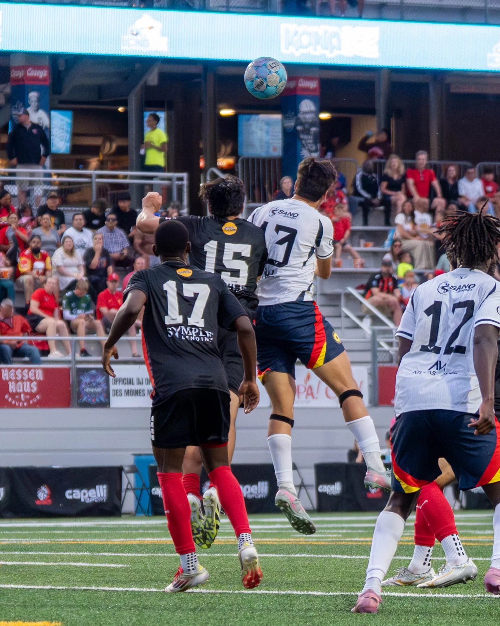 Two players in the air contesting for a header in the box between Sunflower State FC and Des Moines Menace on May 30th, 2026 - Photo by: Austin Farrow