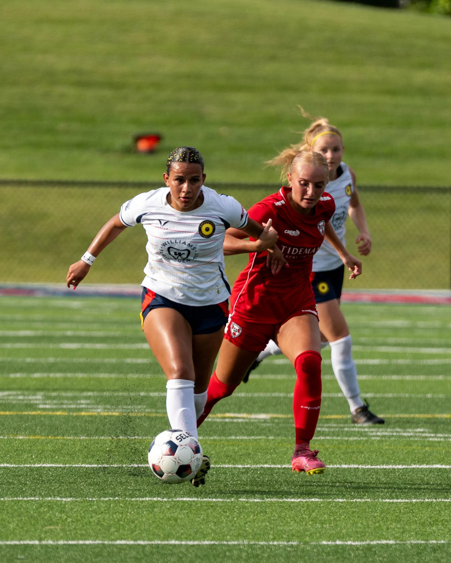 Sunflower State FC's Ximena Arnau dribbles down the field with a Wichita FC defender on her back on June 7th, 2026 - Photo by Austin Farrow