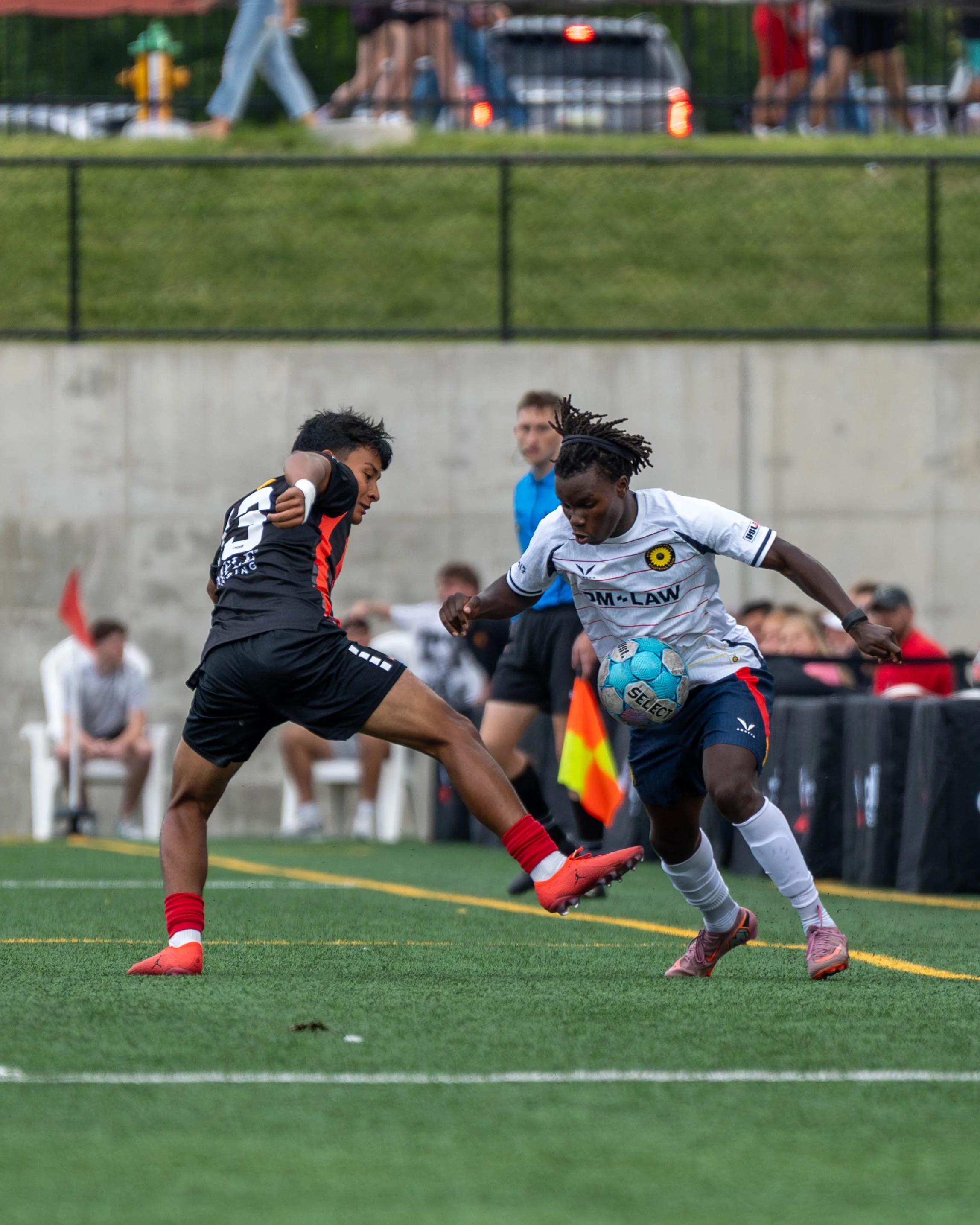 Sunflower State FC player tries to chip ball past Des Moines Menace player on May 30th, 2026 - Photo by: Austin Farrow