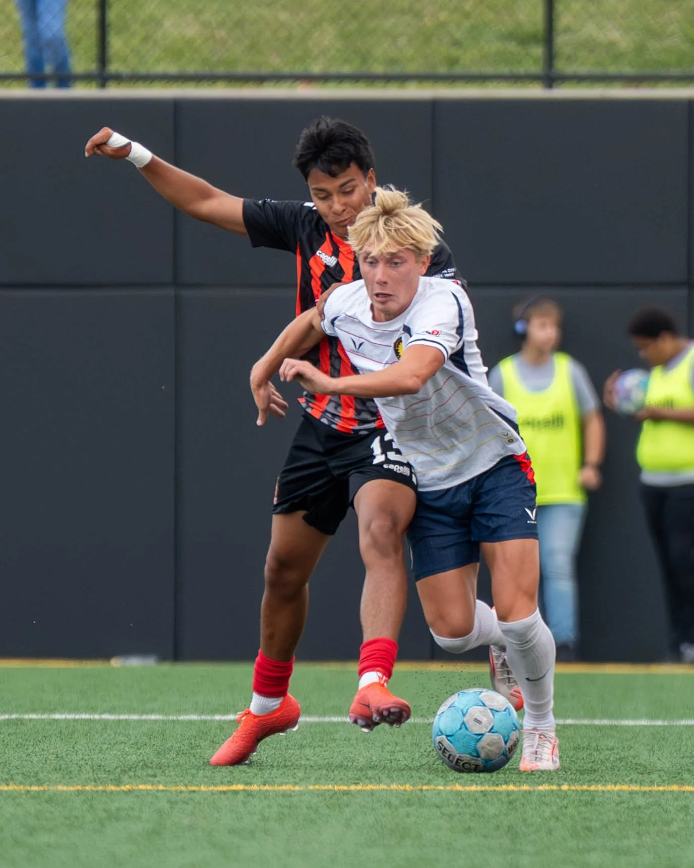 Sunflower State FC player tries to dribble past a Des Moines Menace player while taking contact on May 30th, 2026 - Photo by: Austin Farrow