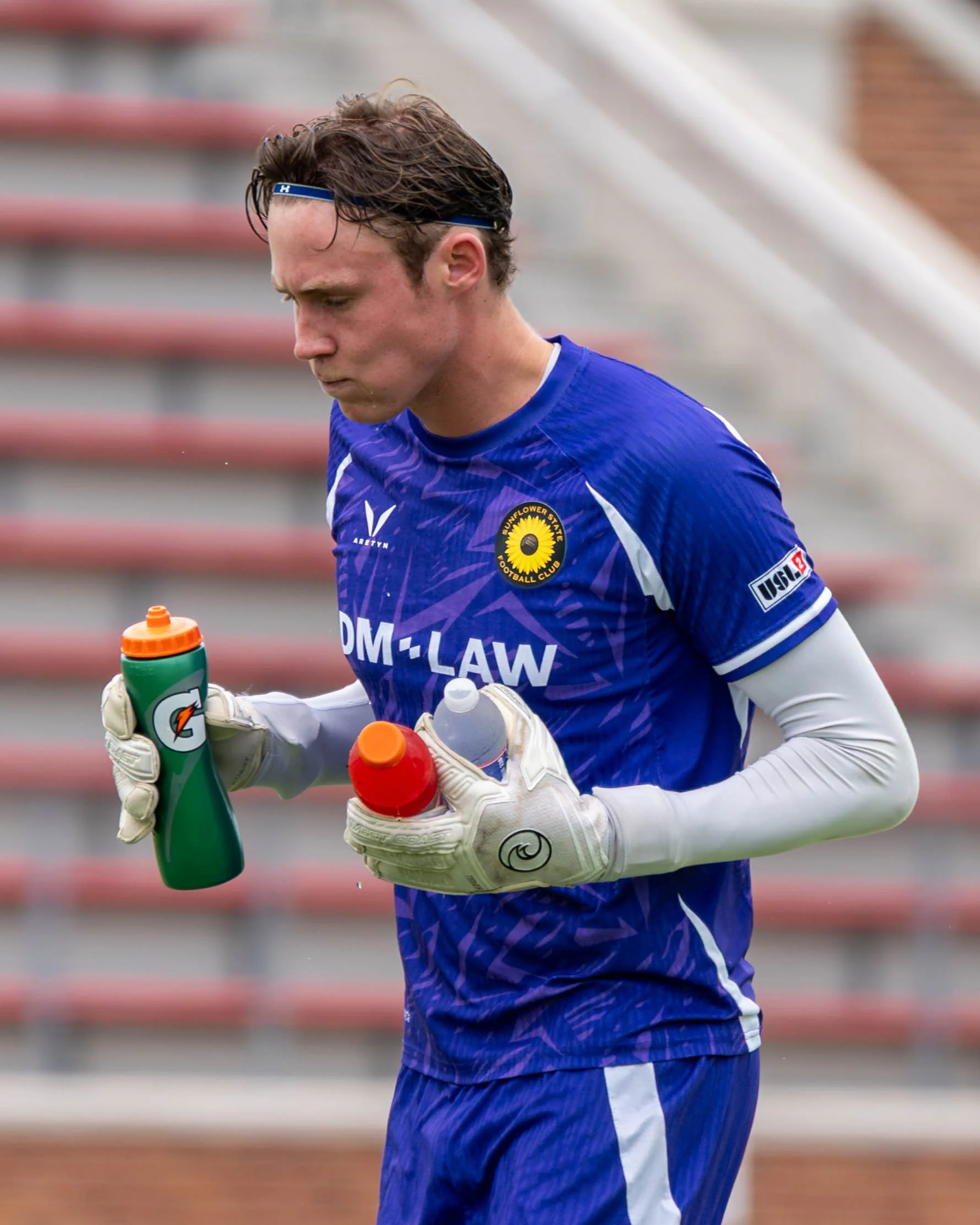 Sunflower State FC goalkeeper running to his goal before kickoff with his water bottles and gatorade at home against Springfield FC on June 6th, 2026 - Photo by: Austin Farrow