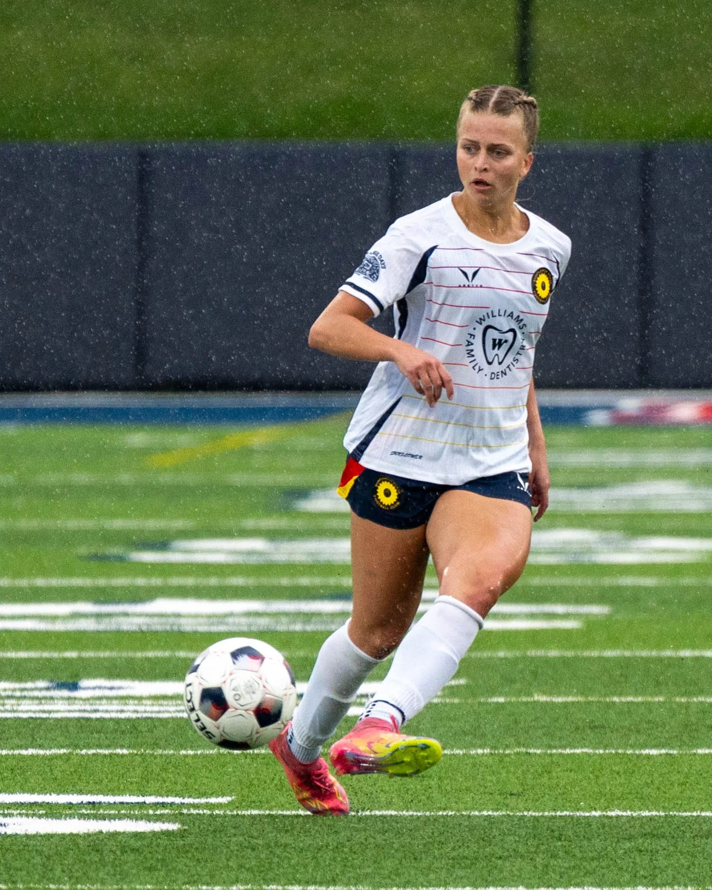 Sunflower State FC's Juliana Wardlaw (#8) makes a pass at home while it is pouring rain vs Wichita FC on June 7th, 2026 - Photo by Austin Farrow