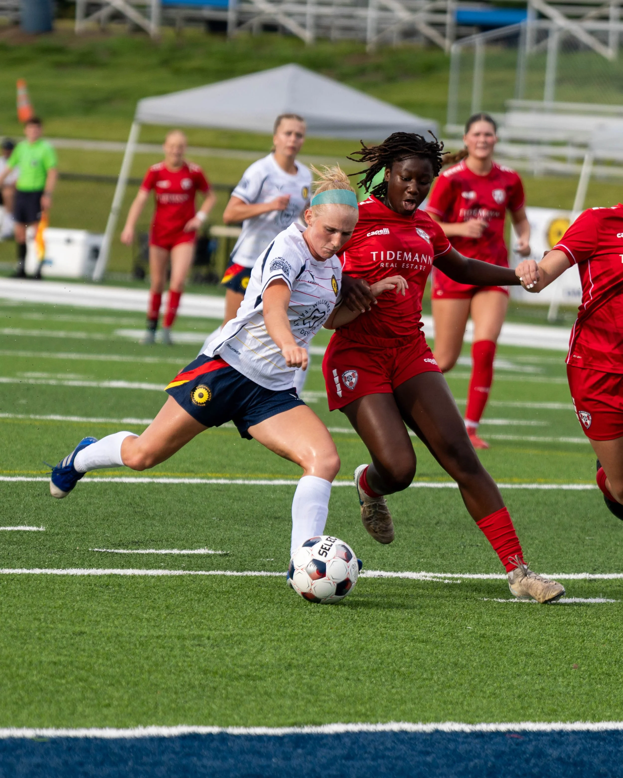 Jenna Hull #9 of Sunflower State FC attempts to take a shot with a defender closing in at home vs Wichita FC on June 7th, 2026 - Photo by Austin Farrow