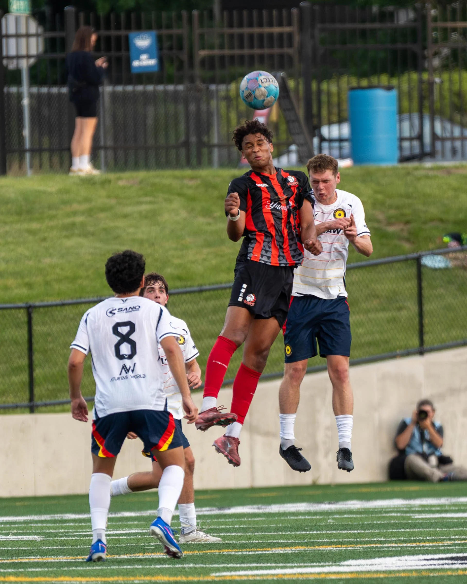 Des Moines Menace player wins a header while being contested in the air at home against Sunflower State FC on May 30th, 2026 - Photo by: Austin Farrow