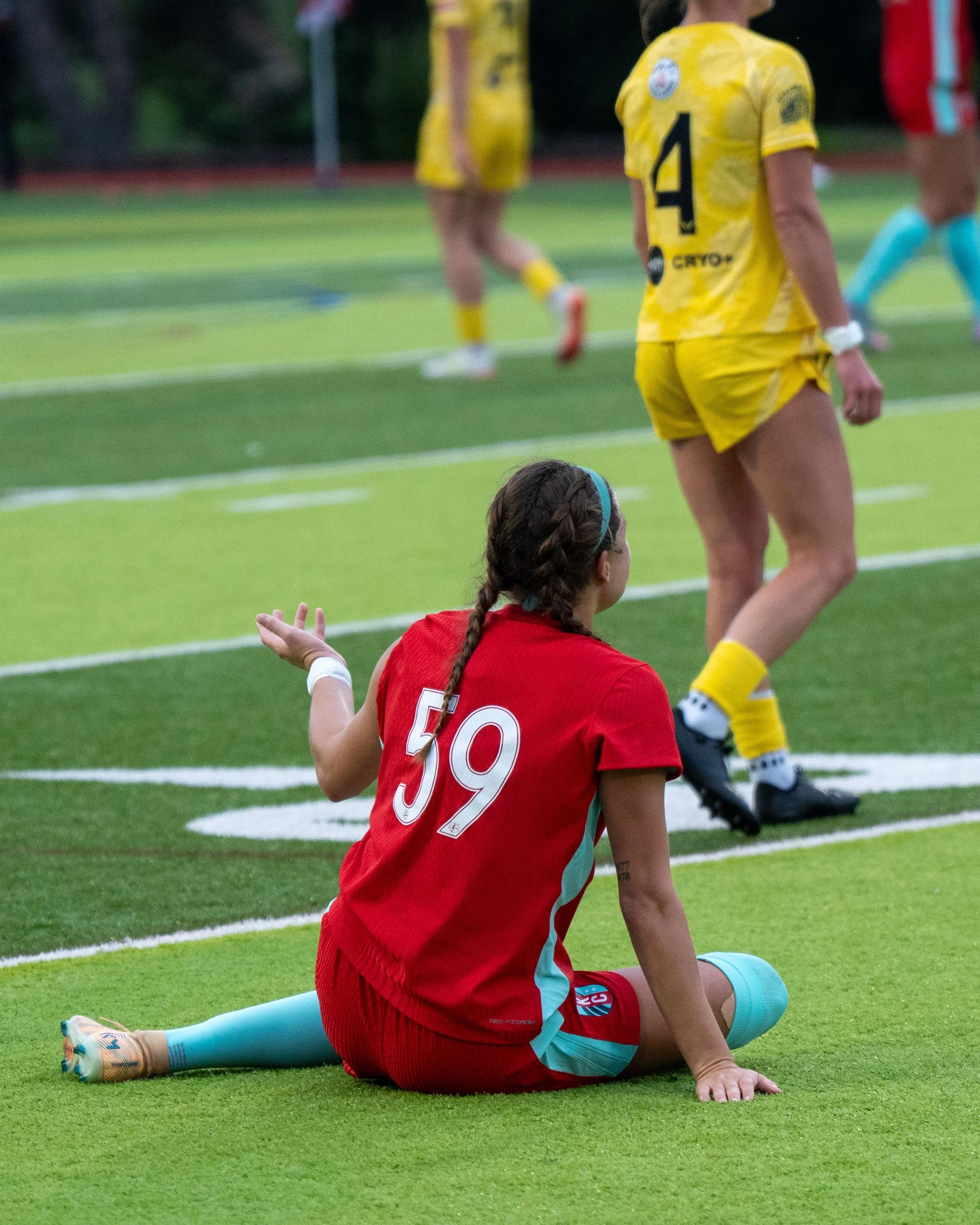 KC Current II player (#59) on the ground asking for a foul after the referee lets play continue on the road at Sunflower State FC on May 20th, 2026 - Photo by: Austin Farrow