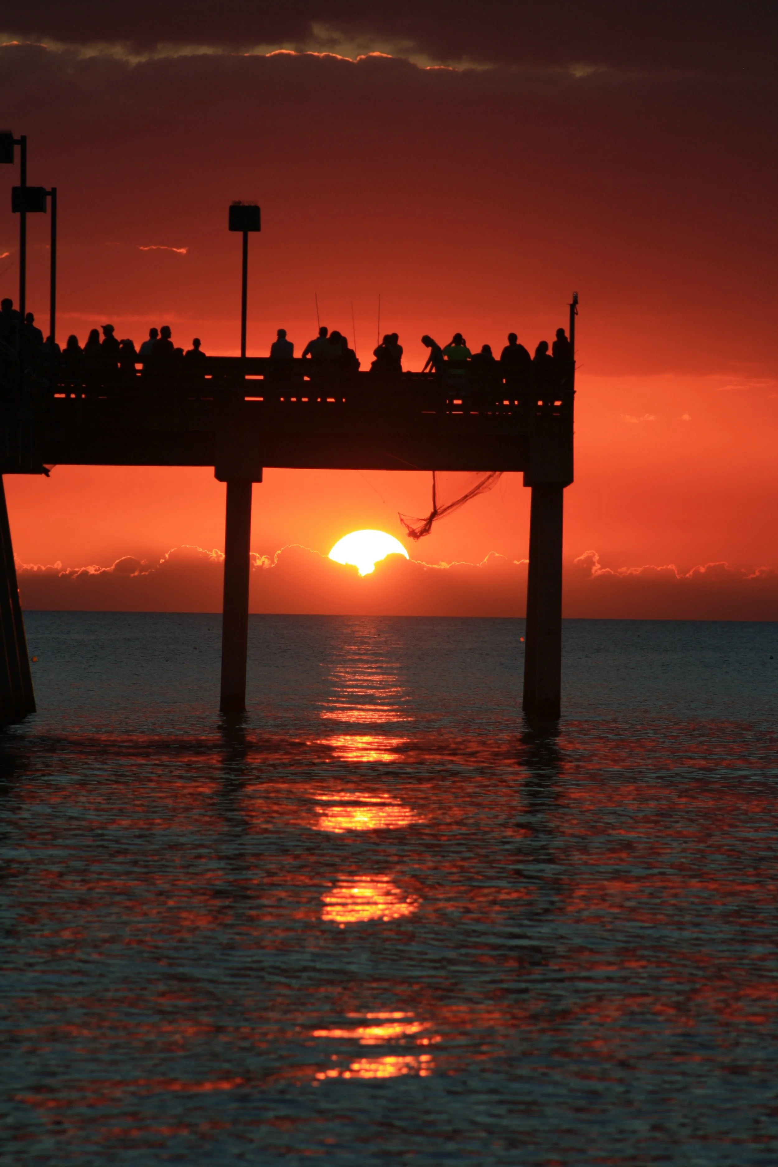 Silhouetted Pier at Sunset