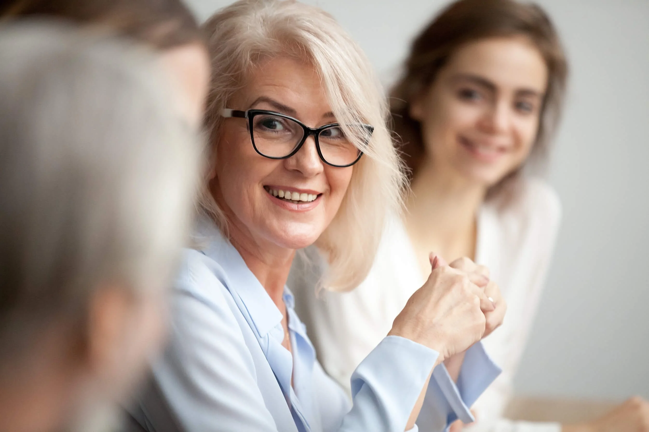 A mature woman enjoying career growth through effective career counselling.