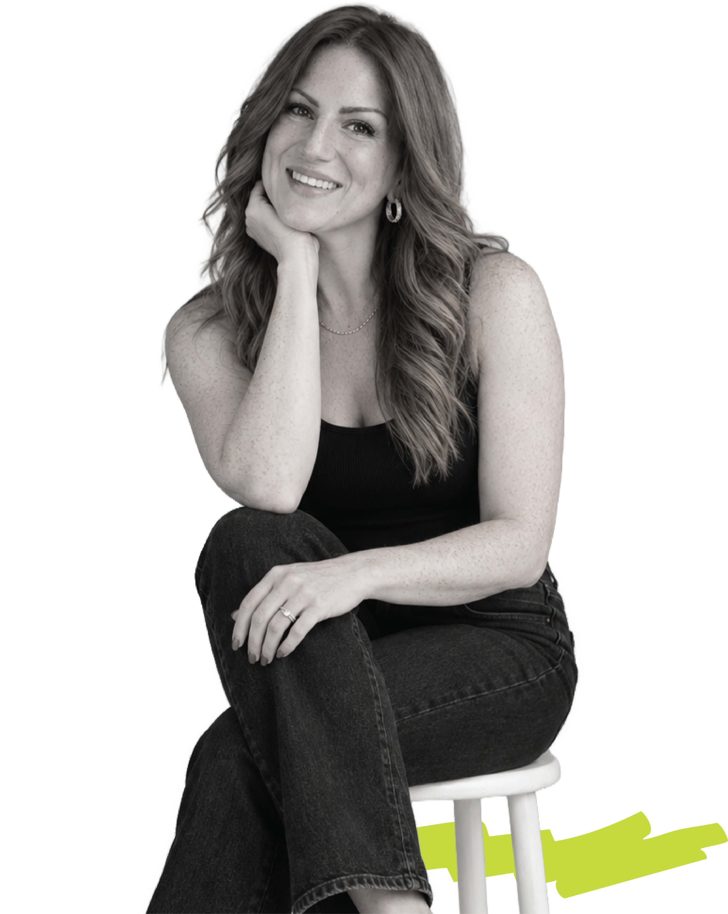 picture Tiffany Varner owner of thresh nine, sitting on stool smiling