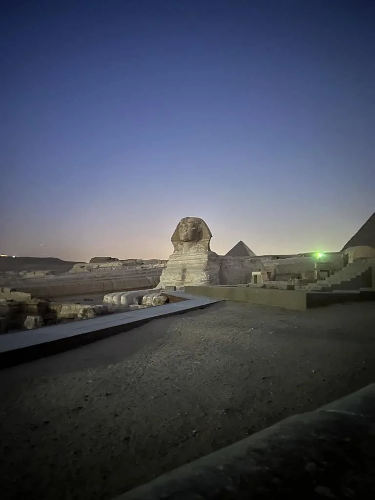 Sphinx and pyramids at sunset in Egypt.