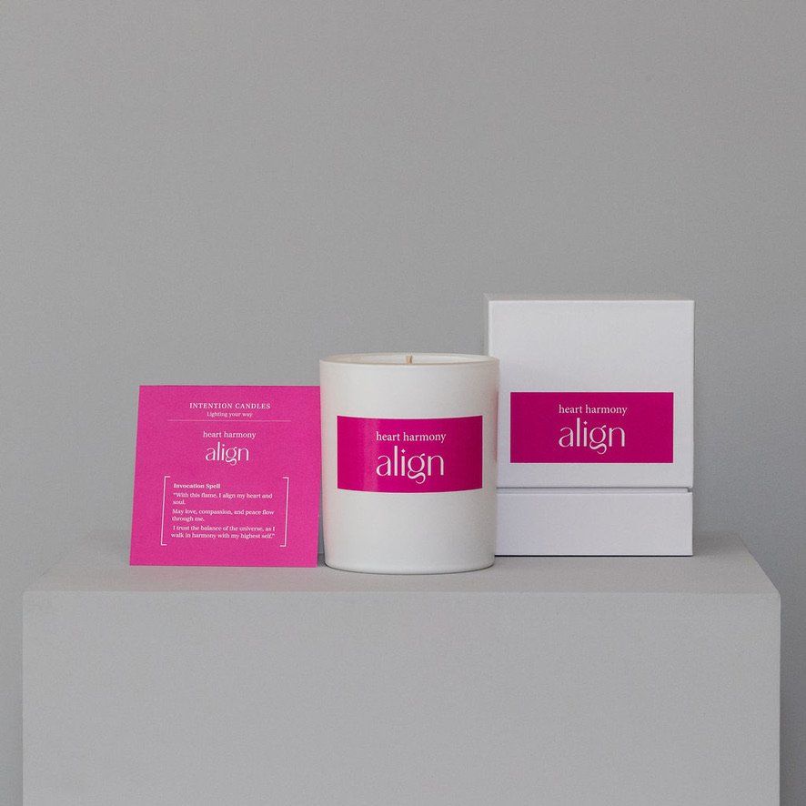 Three health supplement bottles on a white surface with pink labels.