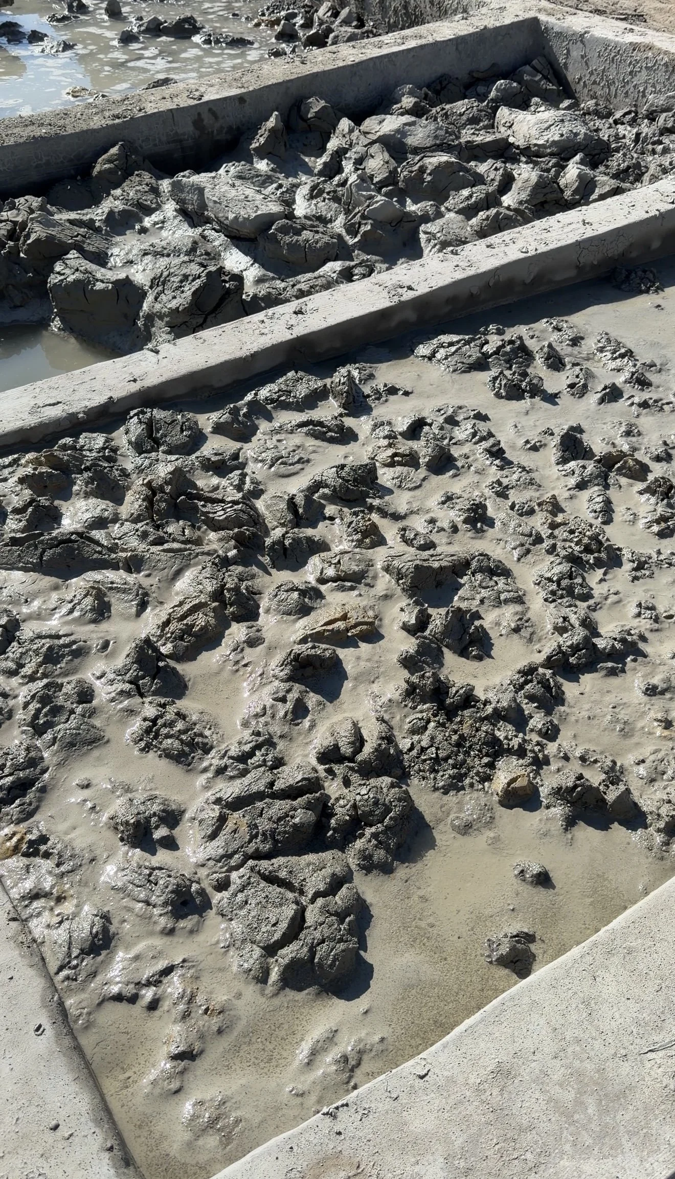 Raw clay soaking in water, first step of handmade tile production in Fez