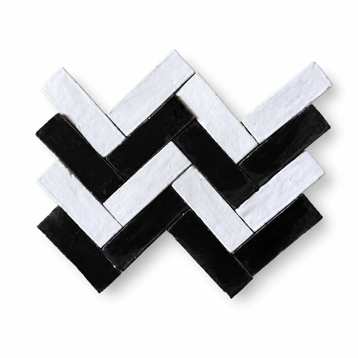 Black and white Bejmat tiles in herringbone pattern, handmade in Fez