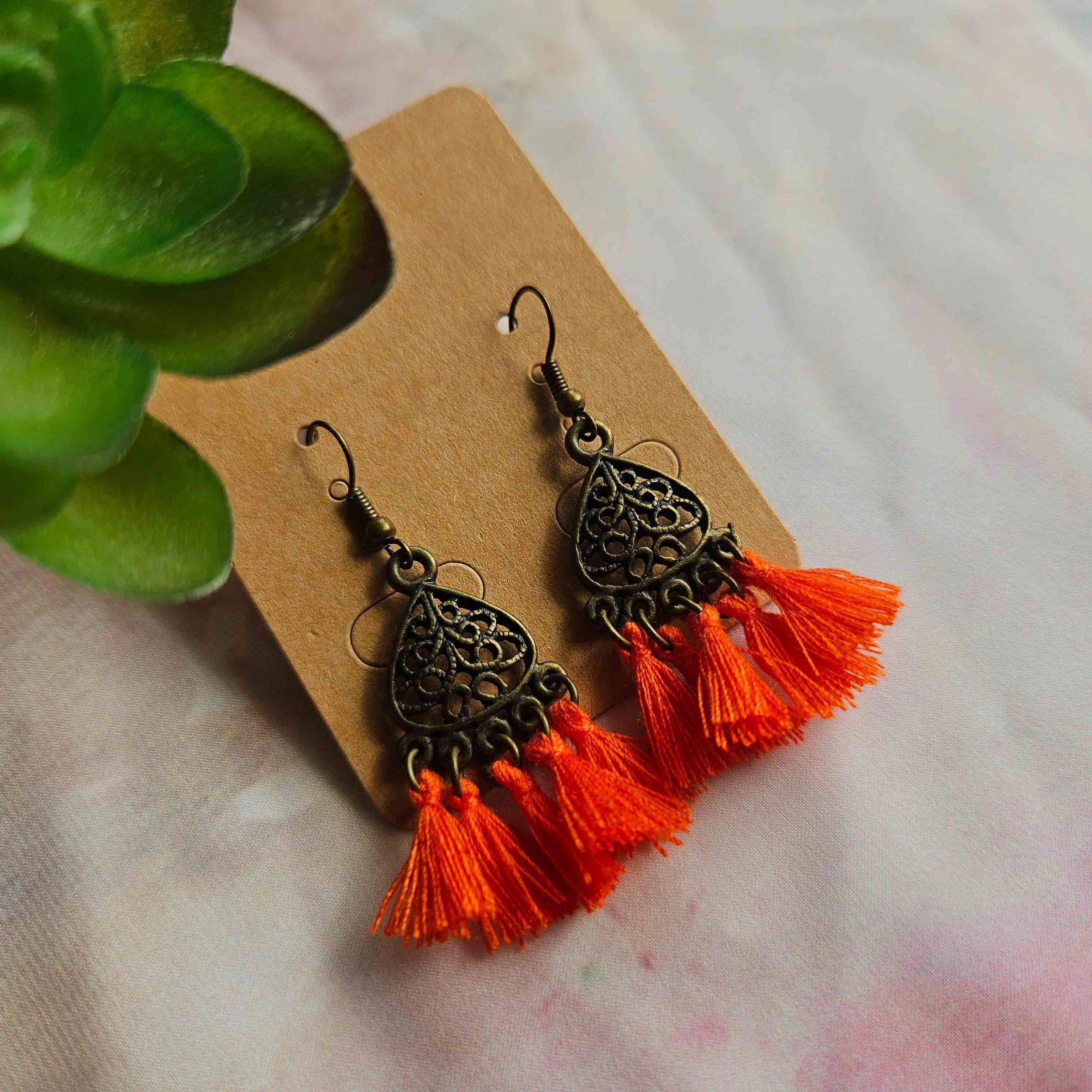 Orange tassel earrings