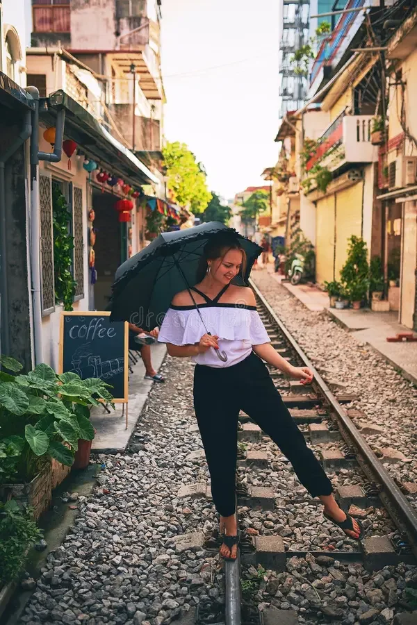 theres-time-to-explore-young-woman-holding-umbrella-exploring-foreign-city-sunny-day-theres-time-279946438.jpg.webp