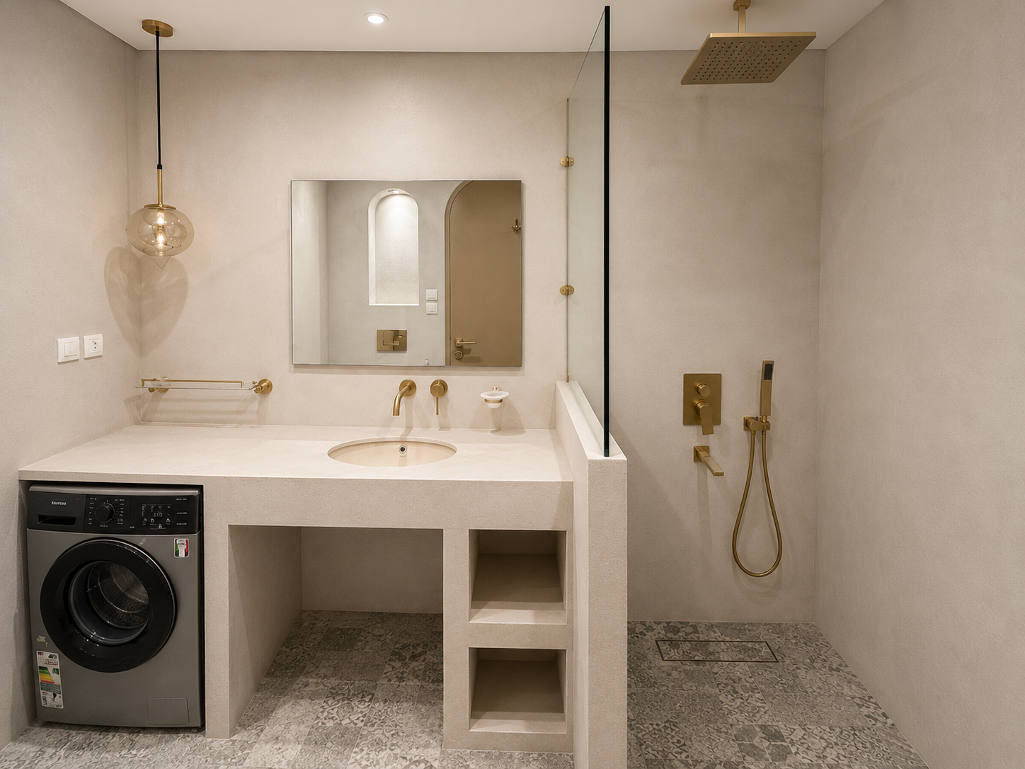 Modern bathroom with a beige countertop, integrated sink, gold hardware, a large mirror, and a walk-in shower with gold fixtures and a glass partition, and a washer in the corner.