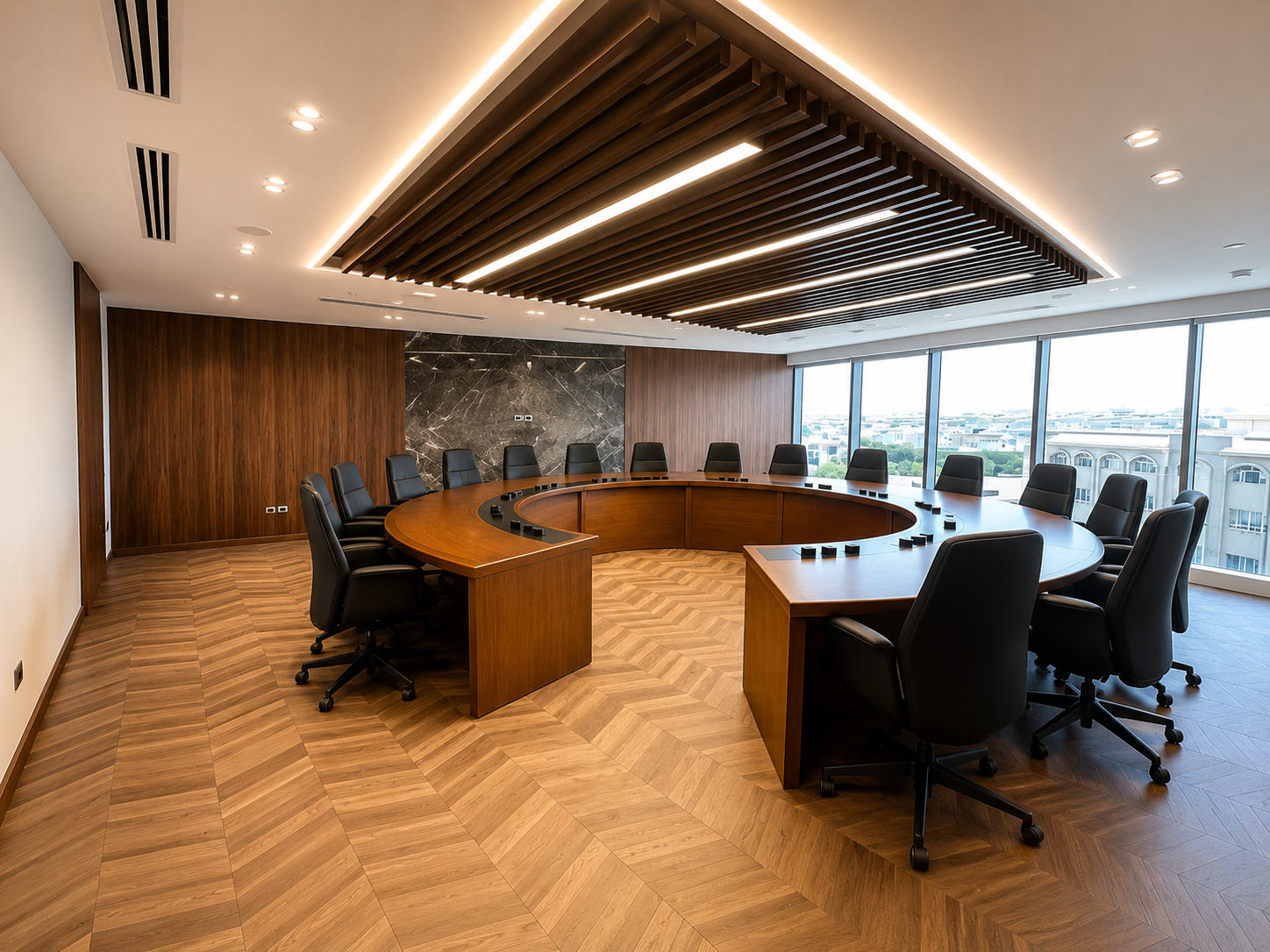 Empty modern conference room with a round wooden table and black leather chairs, large windows with city view, wood and marble wall accents, and wood flooring.