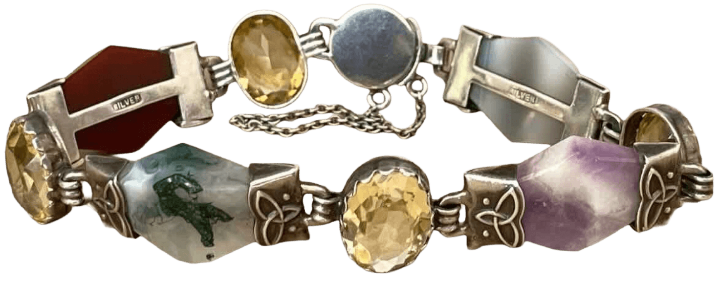 Colorful bracelet with gemstone and metal settings, featuring leaf-shaped accents and chain clasp.