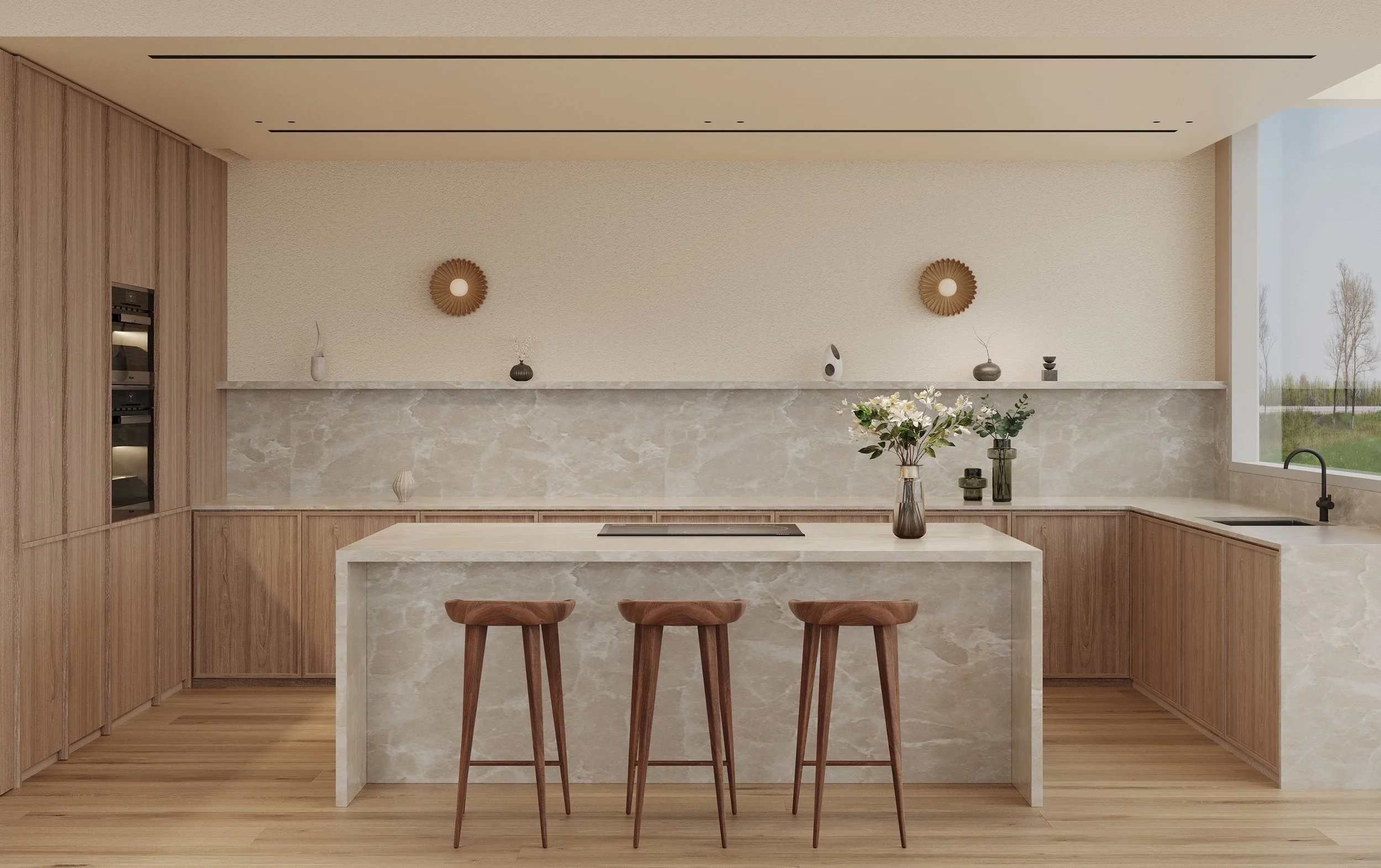 Modern kitchen with wooden cabinets, beige marble island, wall decor, and a large window showing trees outside.