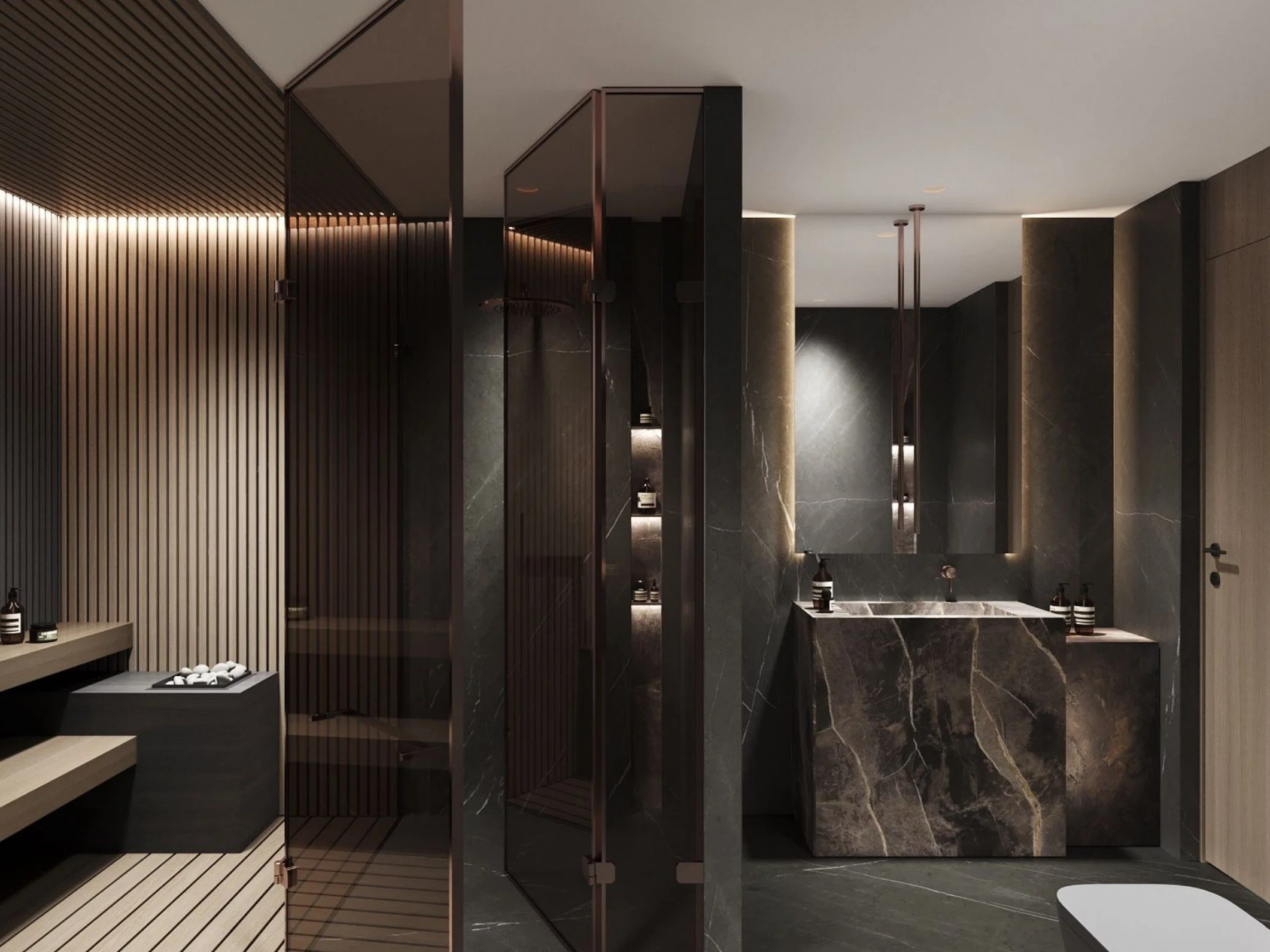Interior of a luxury bathroom or spa with dark marble floors, walls, and shower area, featuring sleek modern fixtures and design elements.