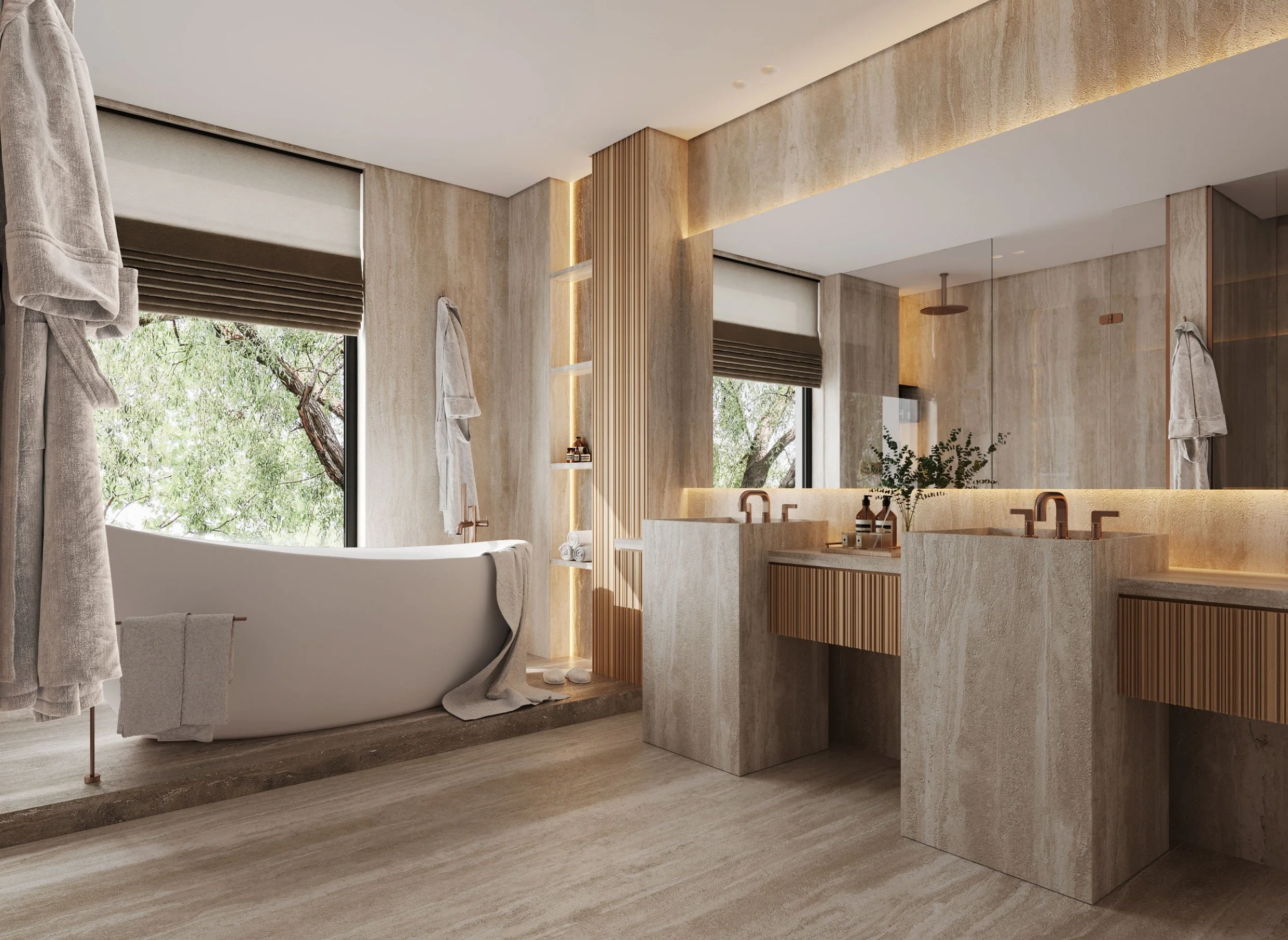 Modern bathroom featuring a freestanding bathtub near a large window with trees outside, beige stone walls, and a vanity with two sinks.