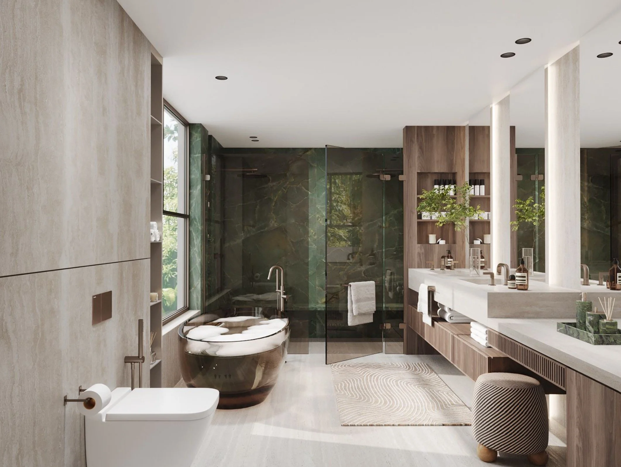 Modern bathroom with beige and green marble walls, glass shower enclosure, wooden cabinets, and a white vanity with a plant and toiletries.