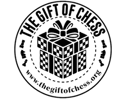 Logo for The Gift of Chess featuring a cube resembling a chessboard with a gift bow on top, surrounded by the website URL.