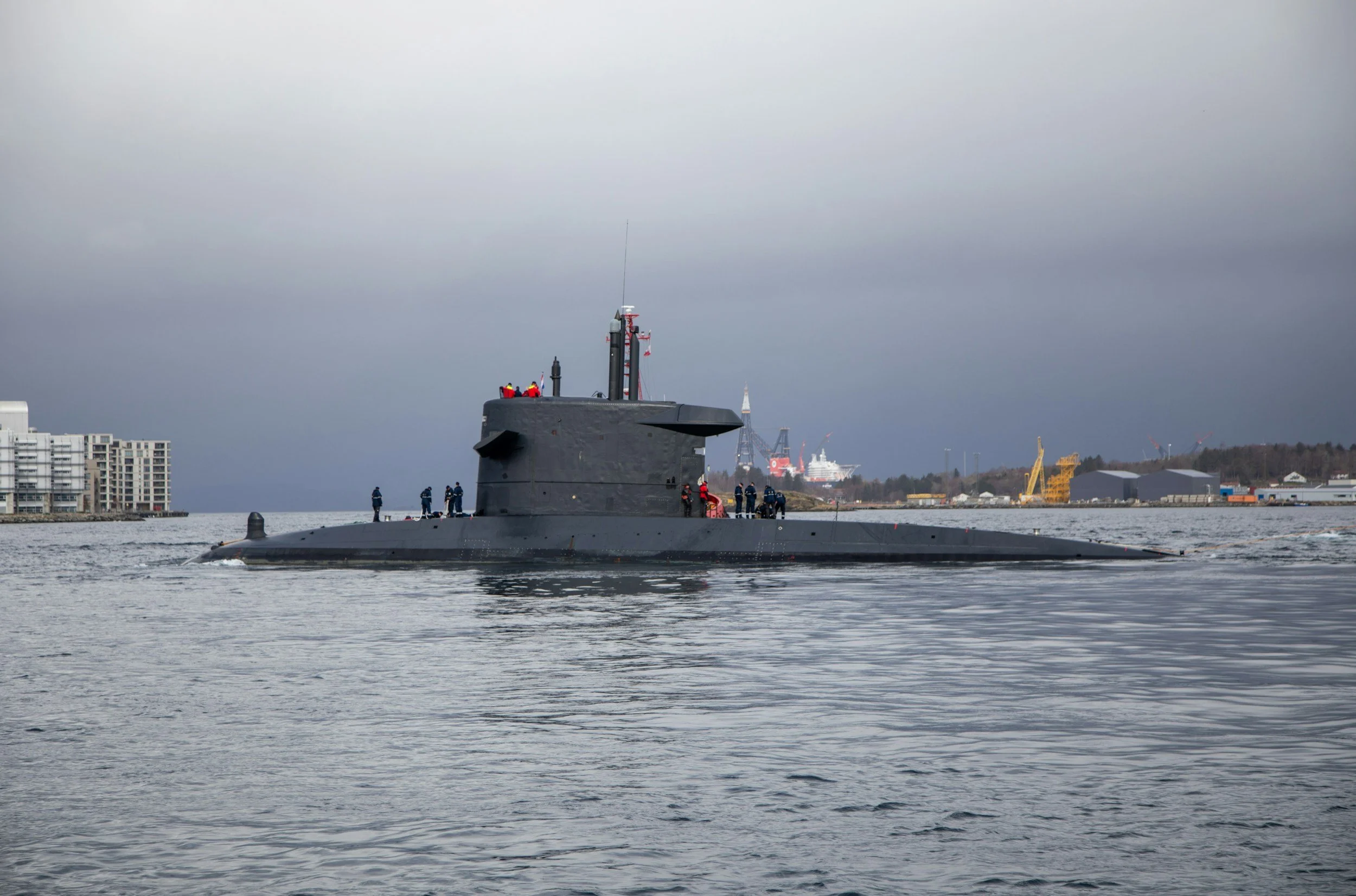Top of a submarine emerging from water