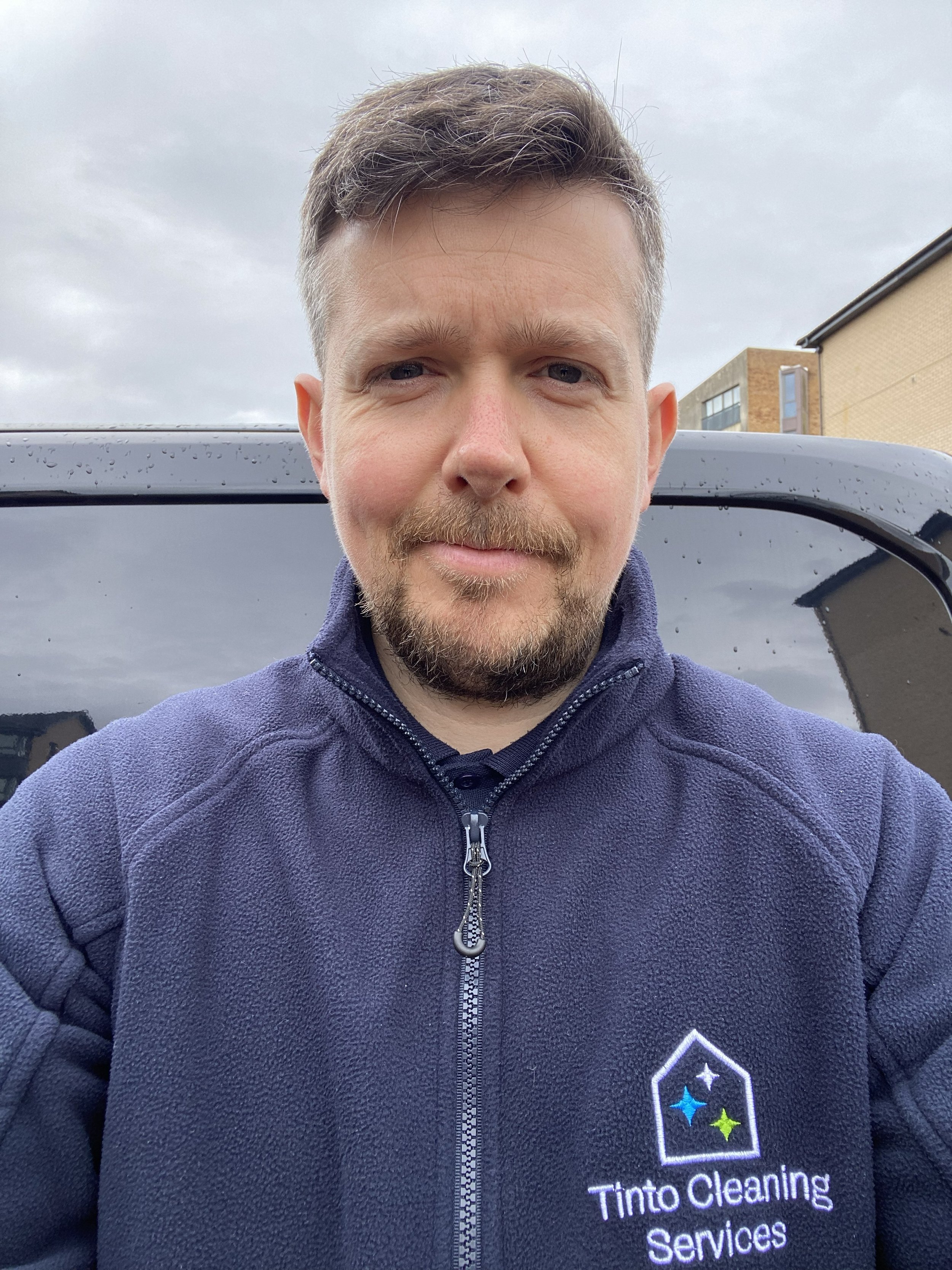 Alasdair wearing Tinto Cleaning Services logo.