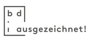 Schwarz-weiße Zeichnung eines Hauses mit dem Text 'i auszeichnet!'