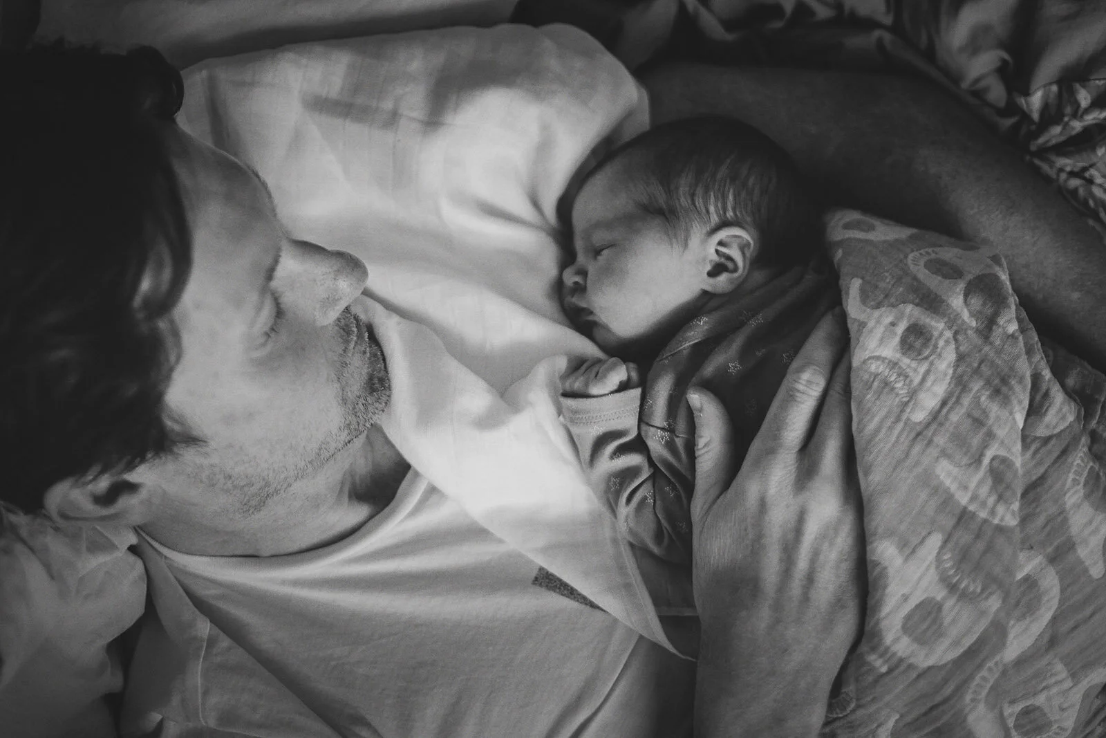 Little Manly Photography father with sleeping newborn baby